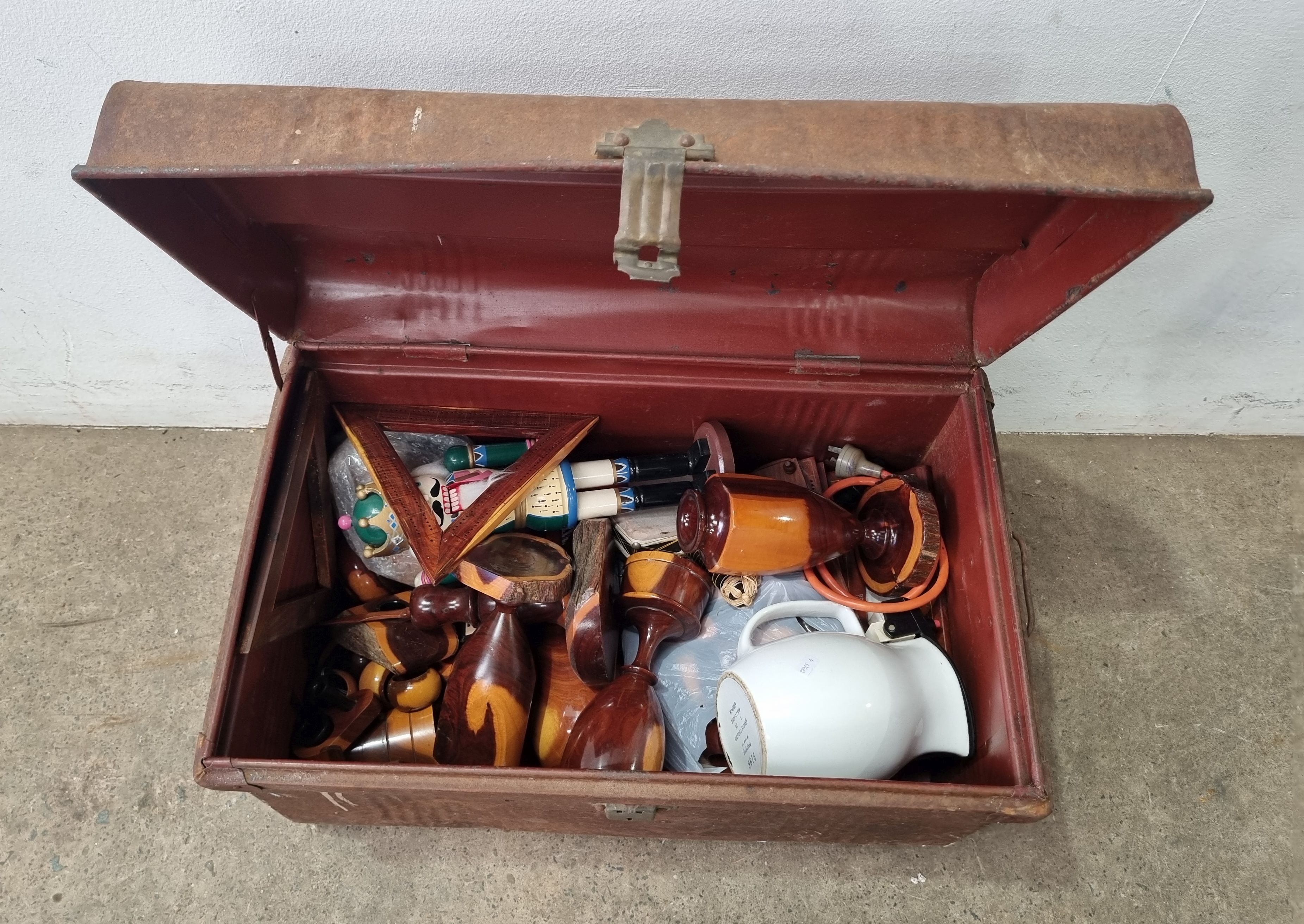 A Rusty Tin Trunk With Contents