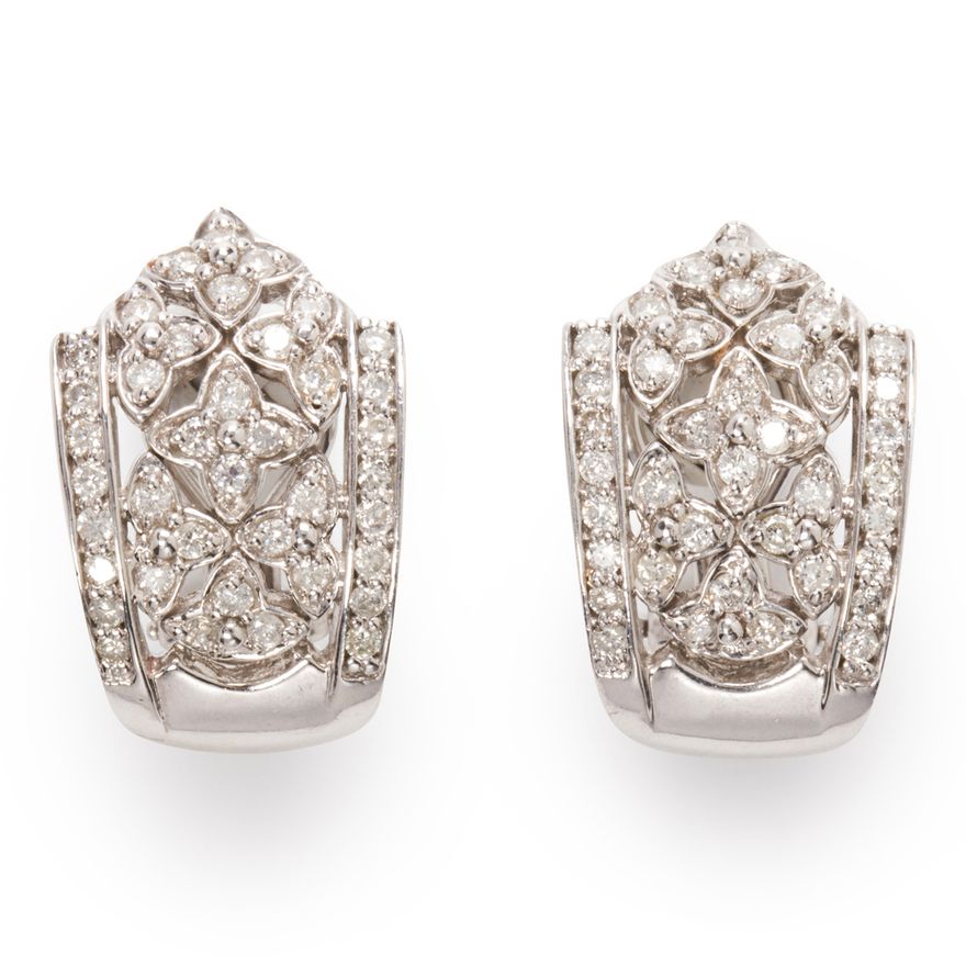 A pair of diamond and fourteen karat white gold ear clips