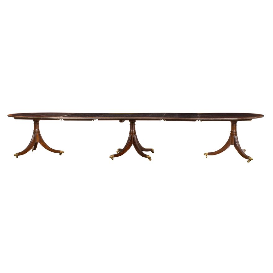 A Regency triple pedestal mahogany banquet table