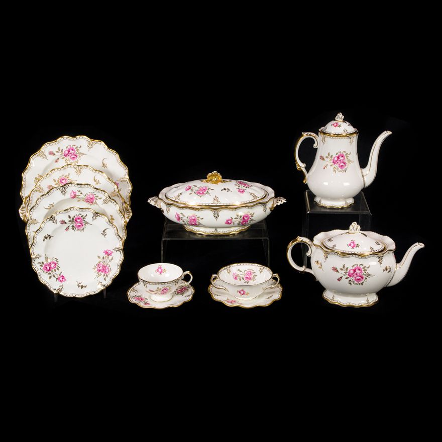An extensive Royal Crown Derby porcelain dinner service in the Royal Pinxton Roses pattern