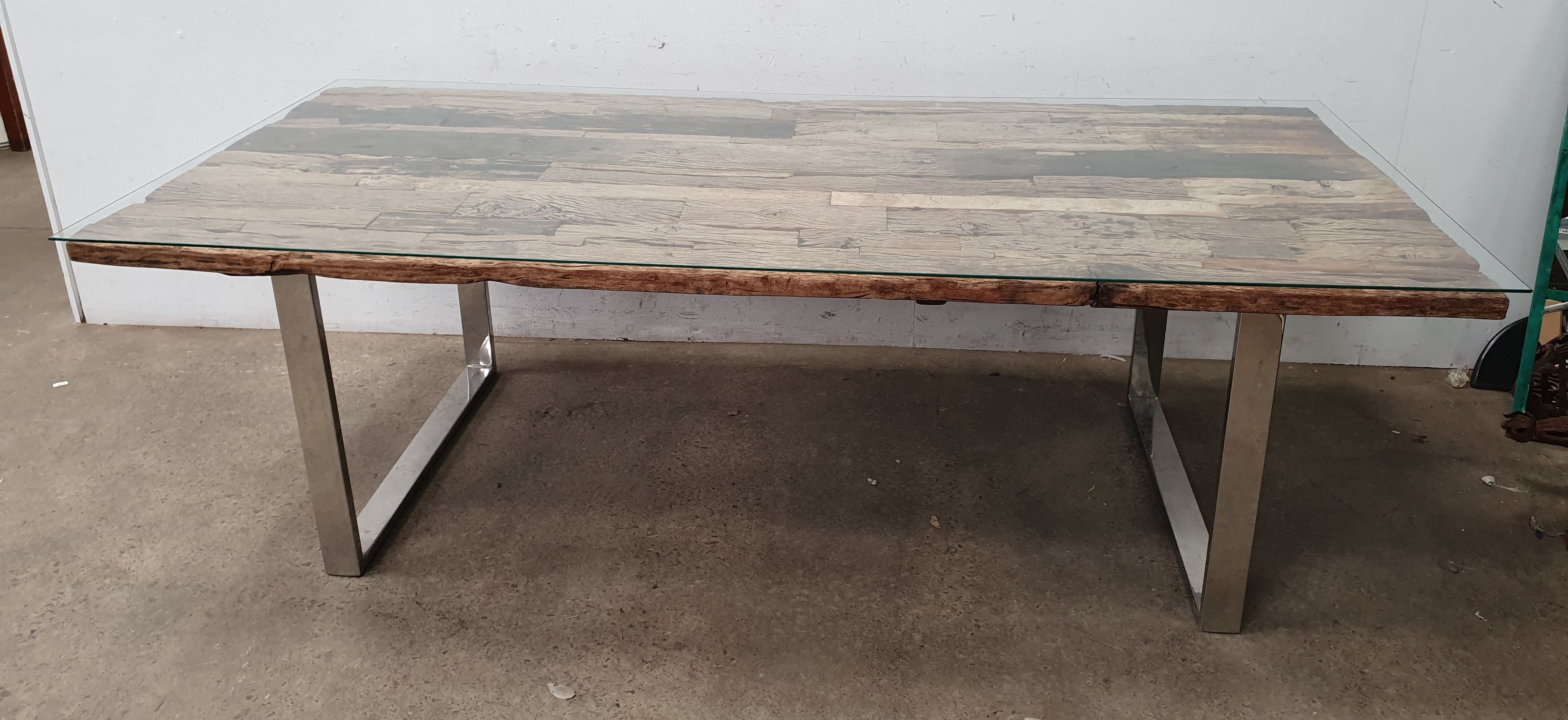 A Reclaimed Wood Glass Top Dining Table