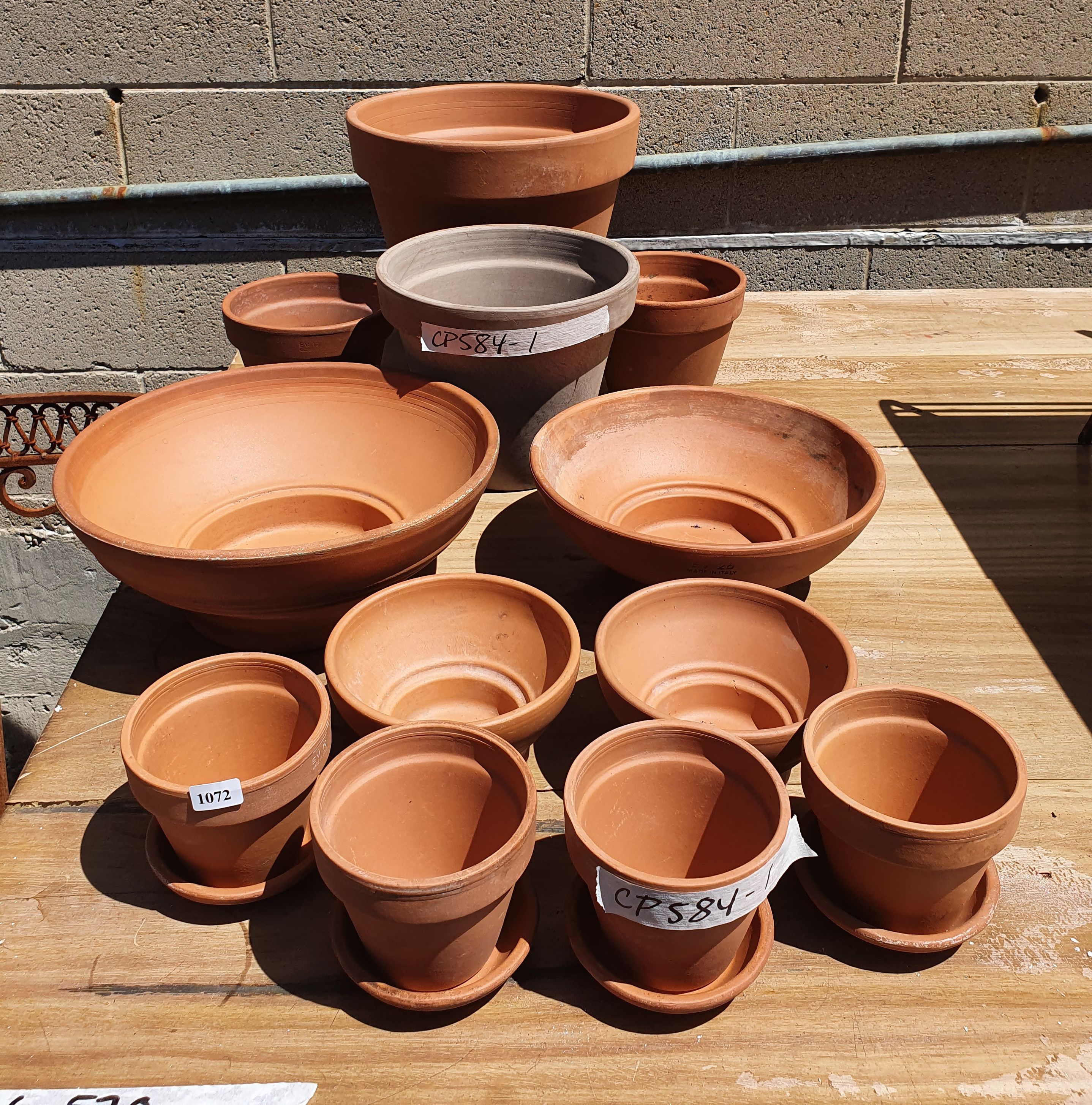 1072 · A GROUP OF TWELVE TERRACOTTA POTS