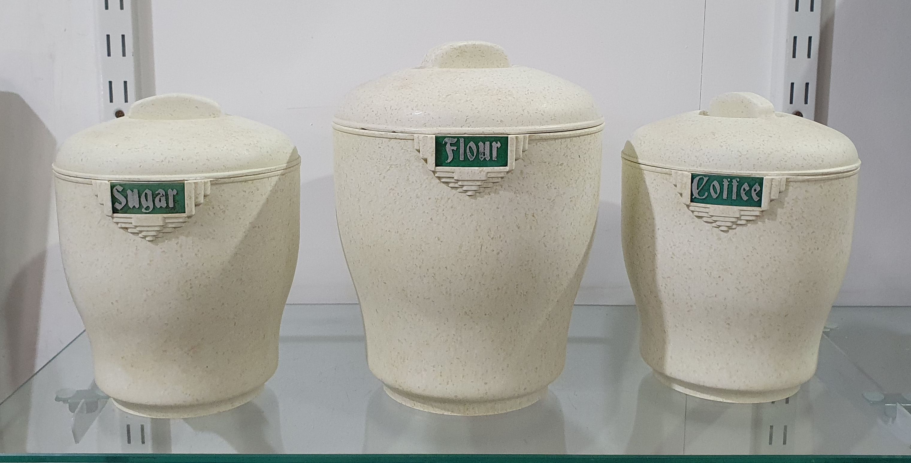 A Set Of Three Bristolite Canisters