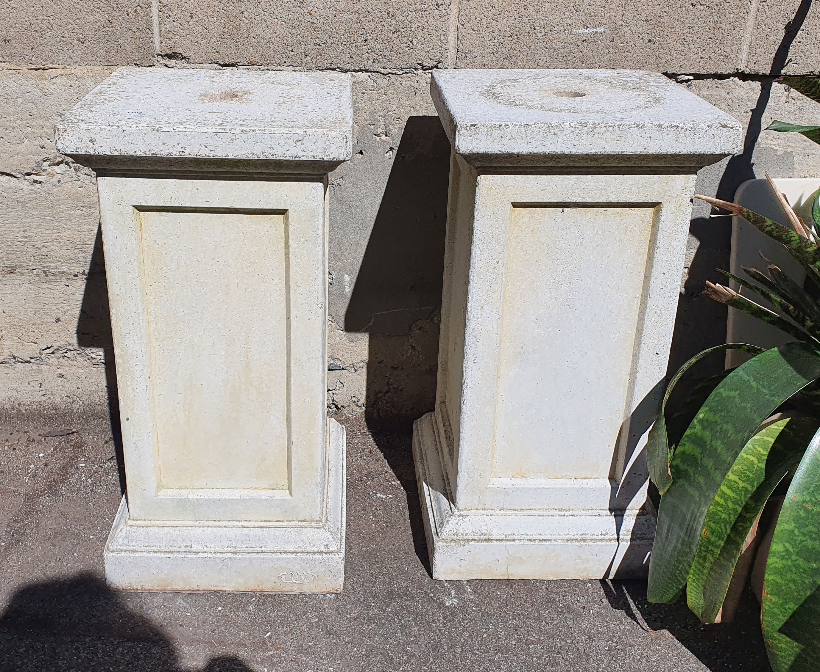 1102 · A PAIR OF CONCRETE PLINTHS
