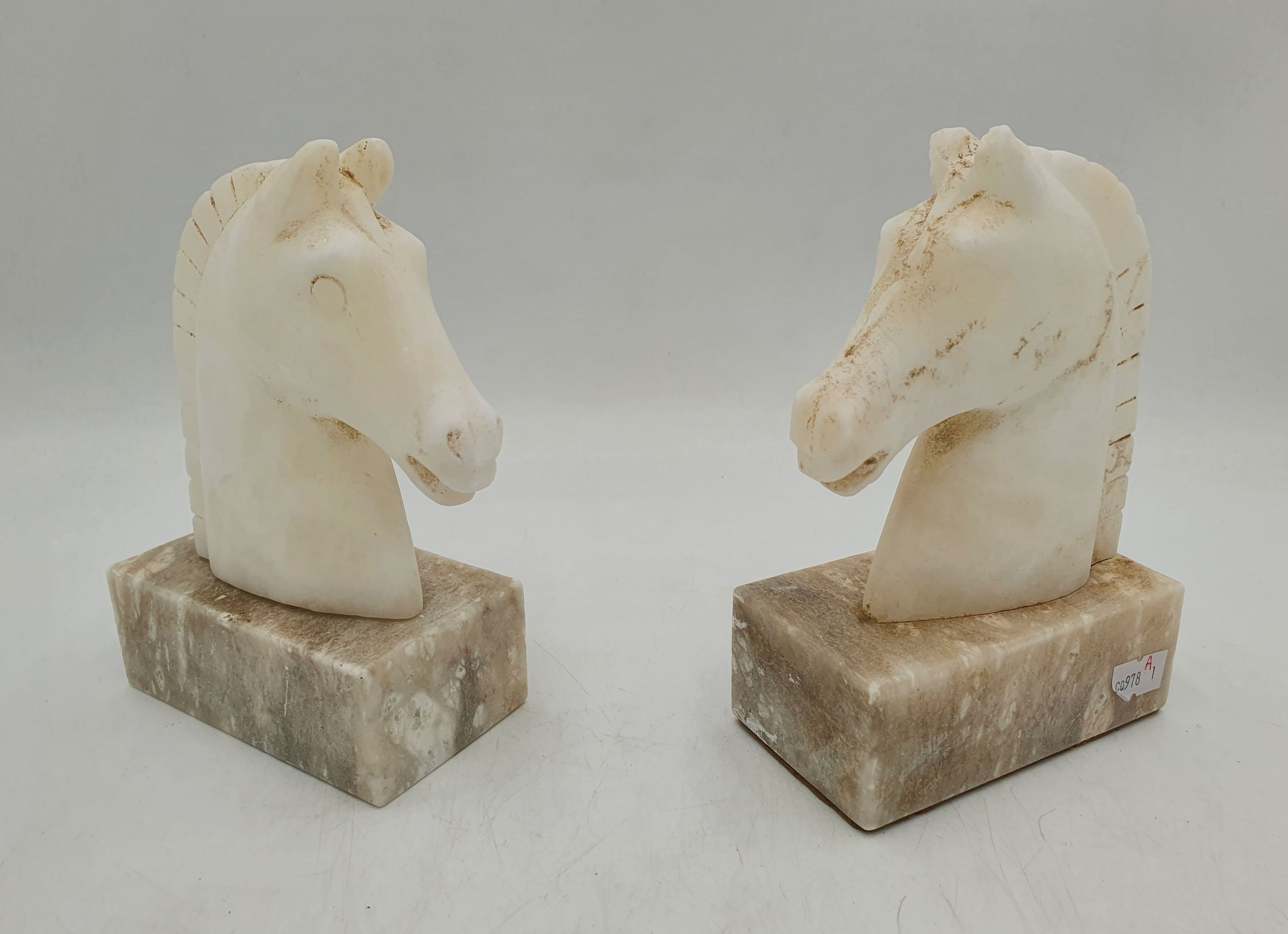 A Pair Of Carved Horse Head Bookends