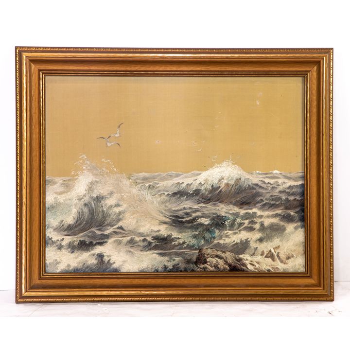 A framed embroidery of a seascape