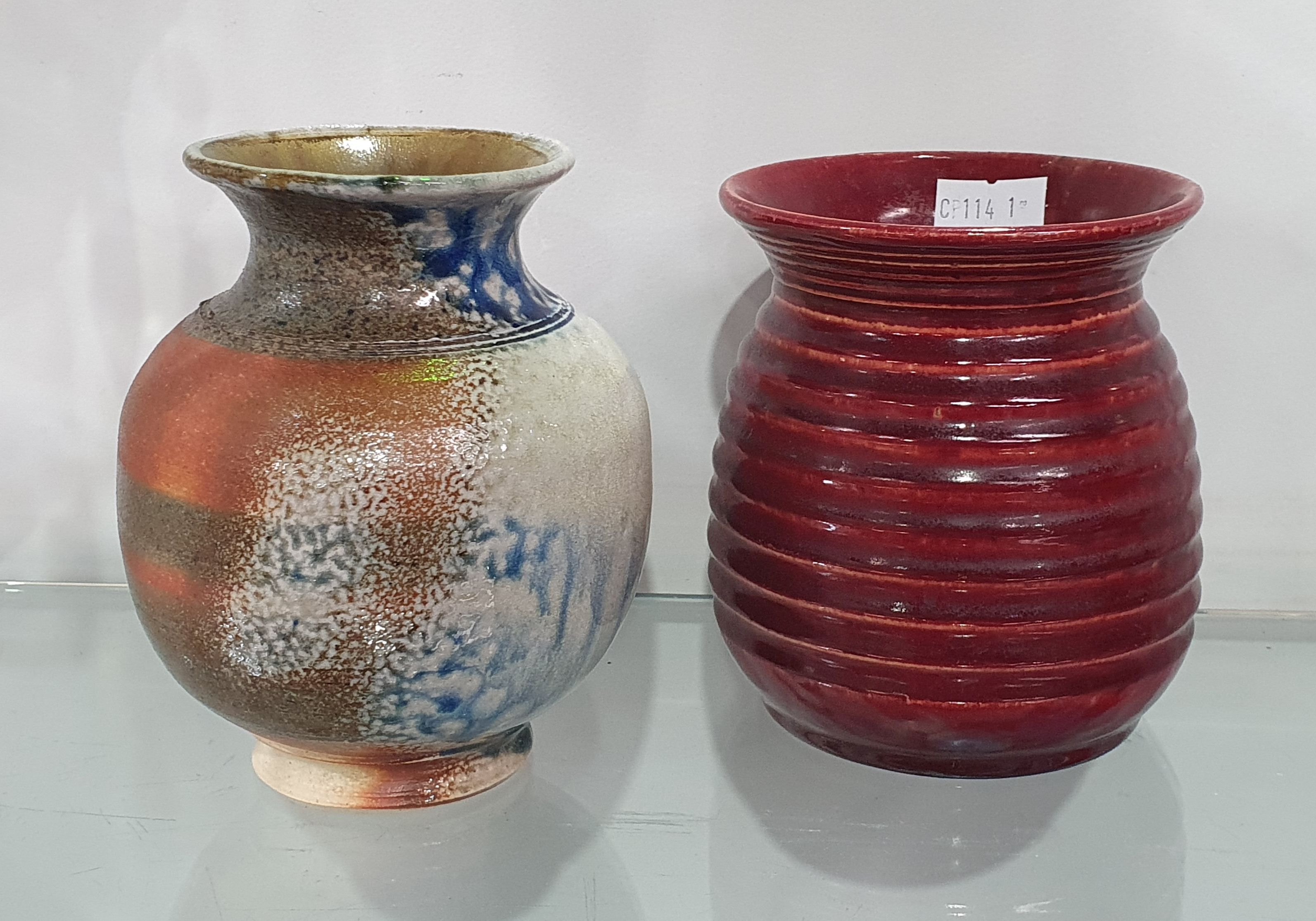 A John Campbell Burgundy Glazed And Ribbed Pottery Vase