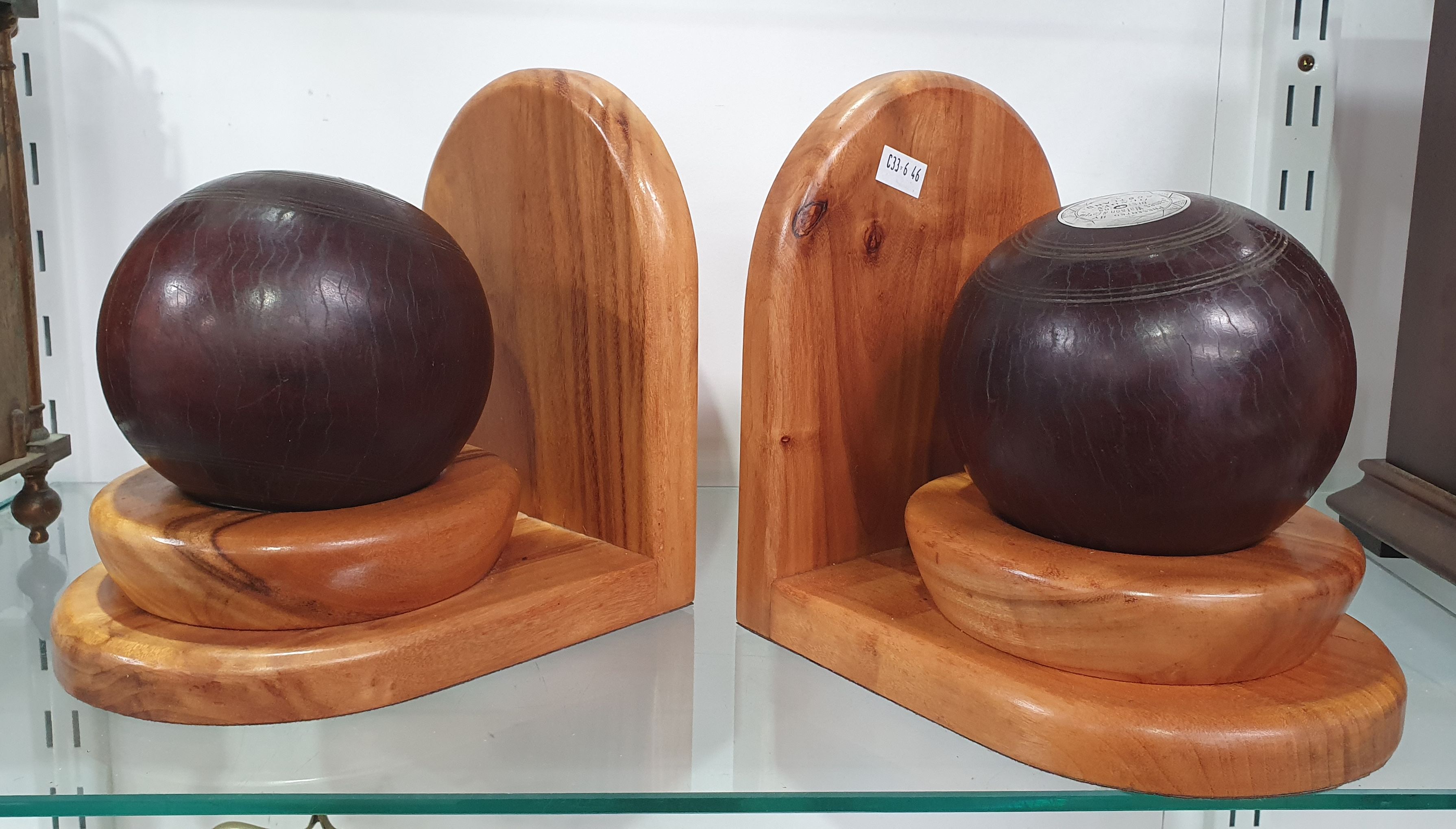AN ANTIQUE PAIR OF SCOTTISH LAWN BOWL BOOK ENDS