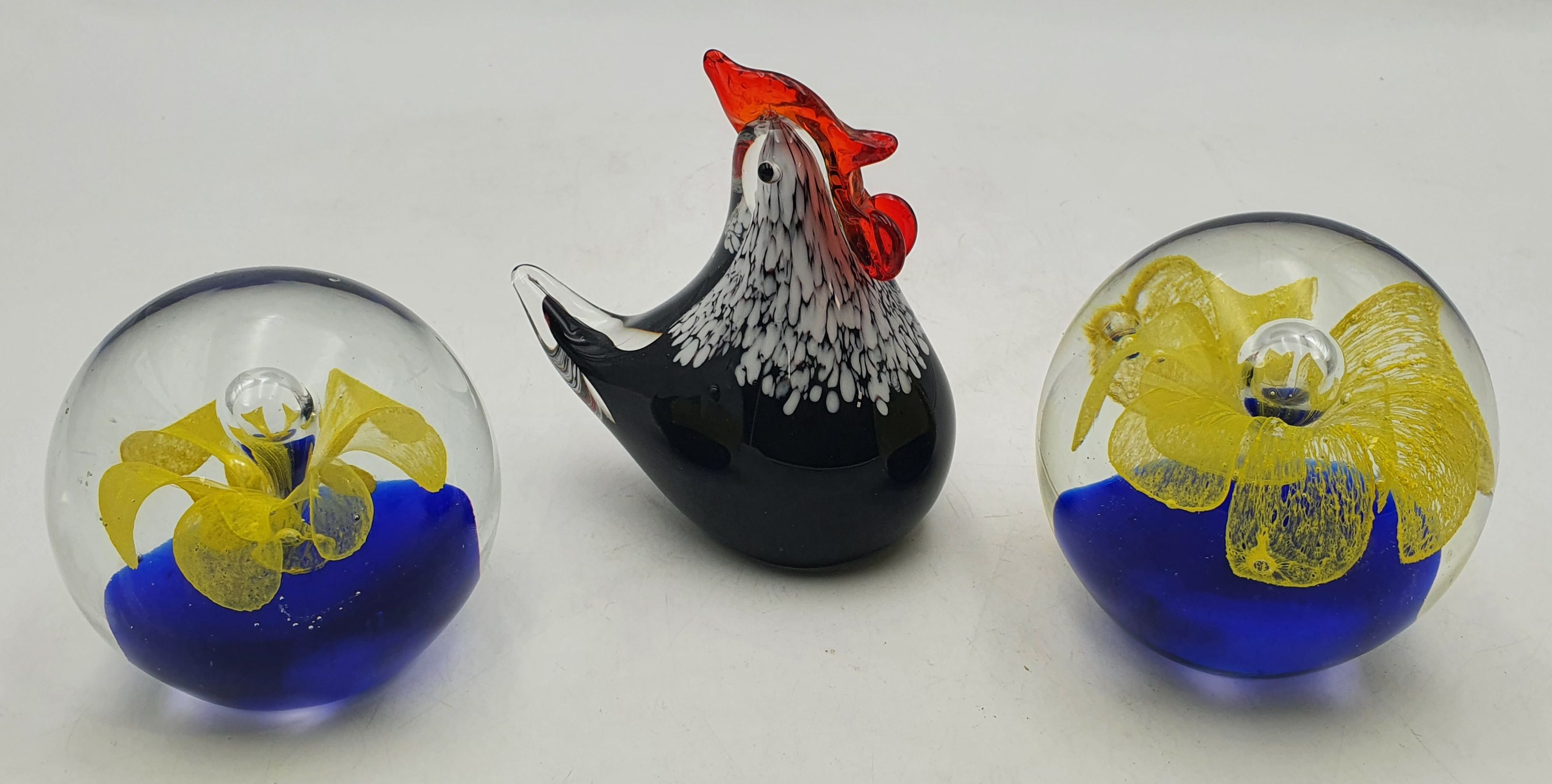 587 · THREE GLASS PAPERWEIGHTS