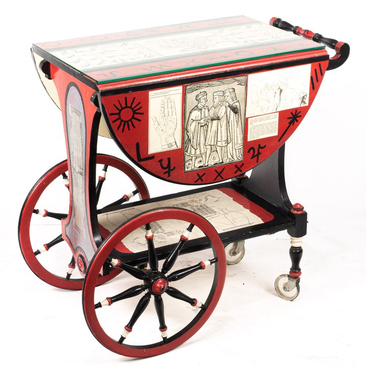 Fornasetti style red painted decoupage bar cart, 29"h x 28