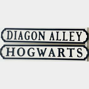 Two Harry Potter related wooden signs, L. 78cm.