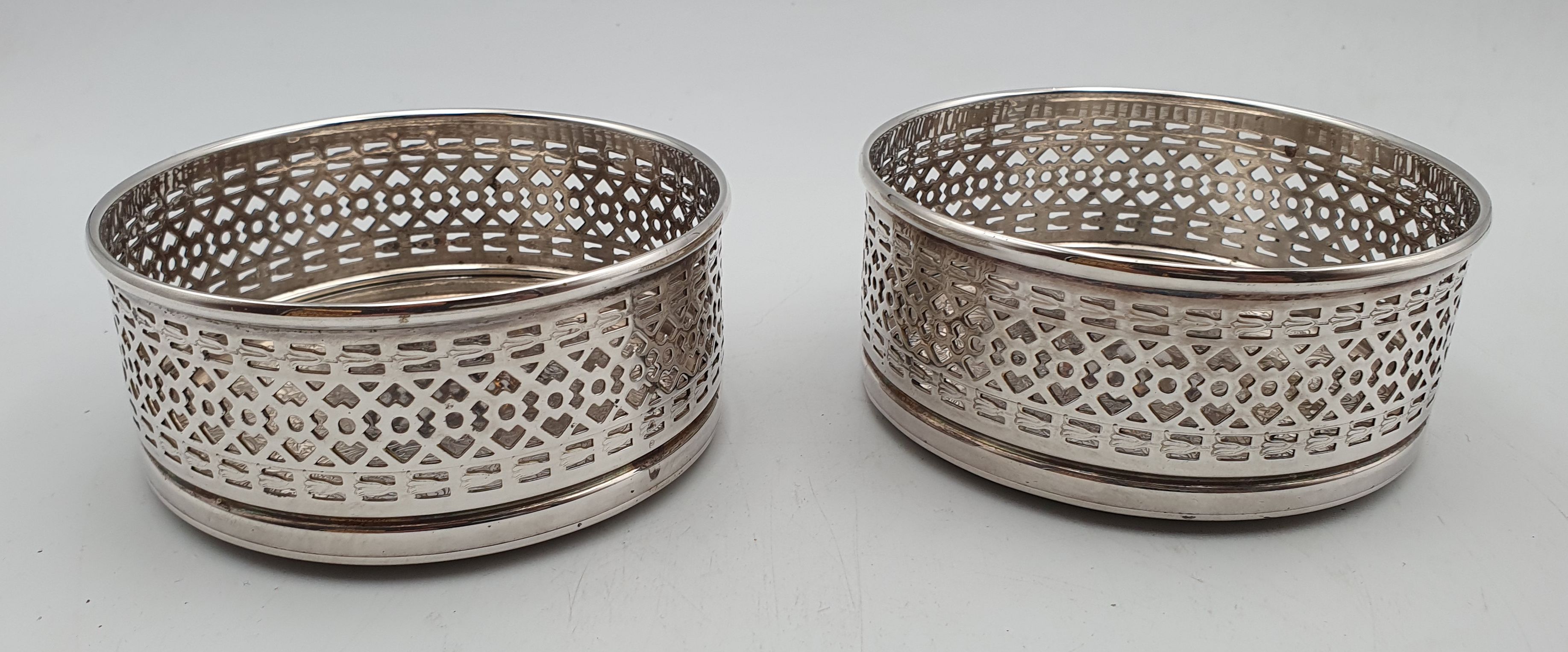 94 · A PAIR OF STRACHAN SILVERPLATED WINE BOTTLE COASTERS