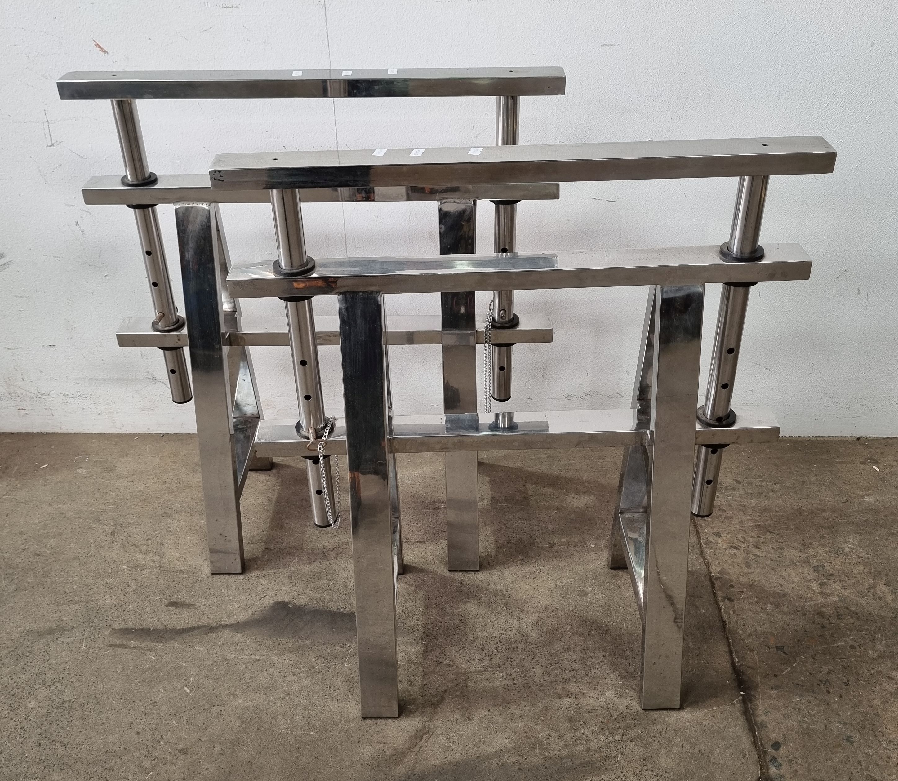 A Set Of Stainless Steel Adjustable Horses
