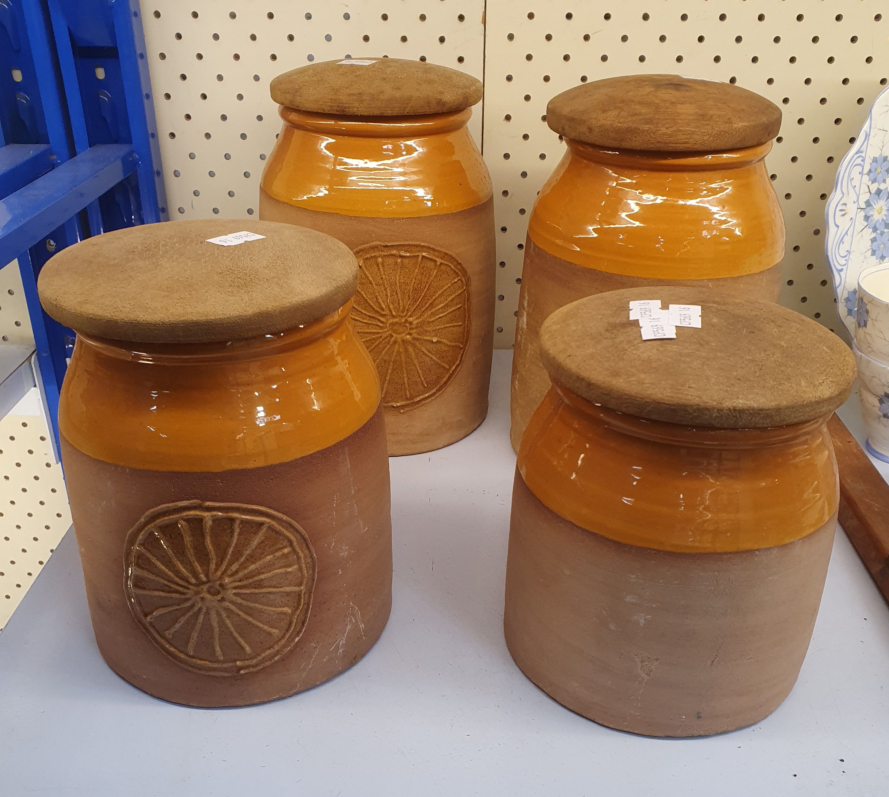 83 · A SET OF FOUR KEMETY POTTERY CANISTERS
