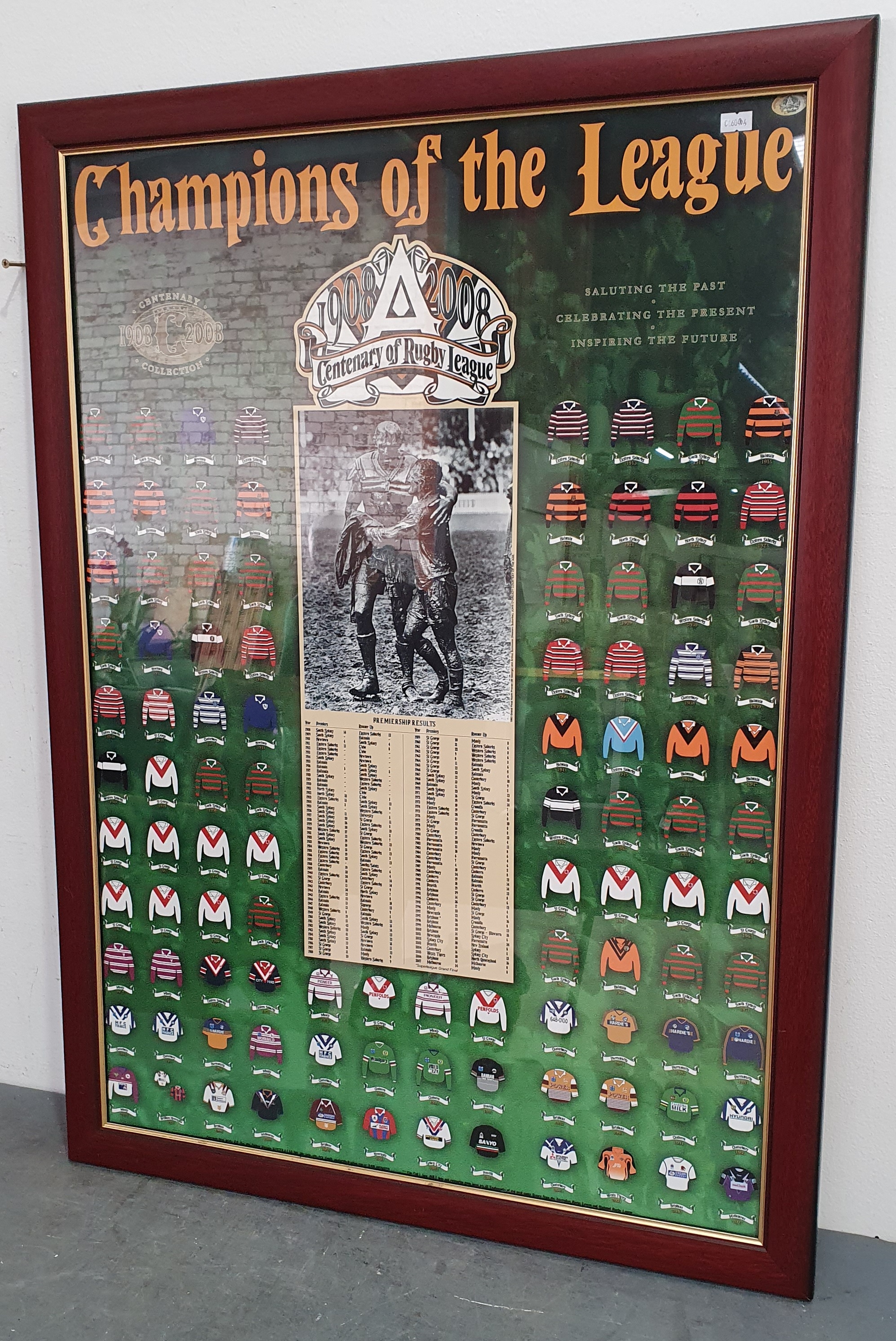A FRAMED POSTER 'CHAMPIONS OF THE LEAGUE 1908-2008'