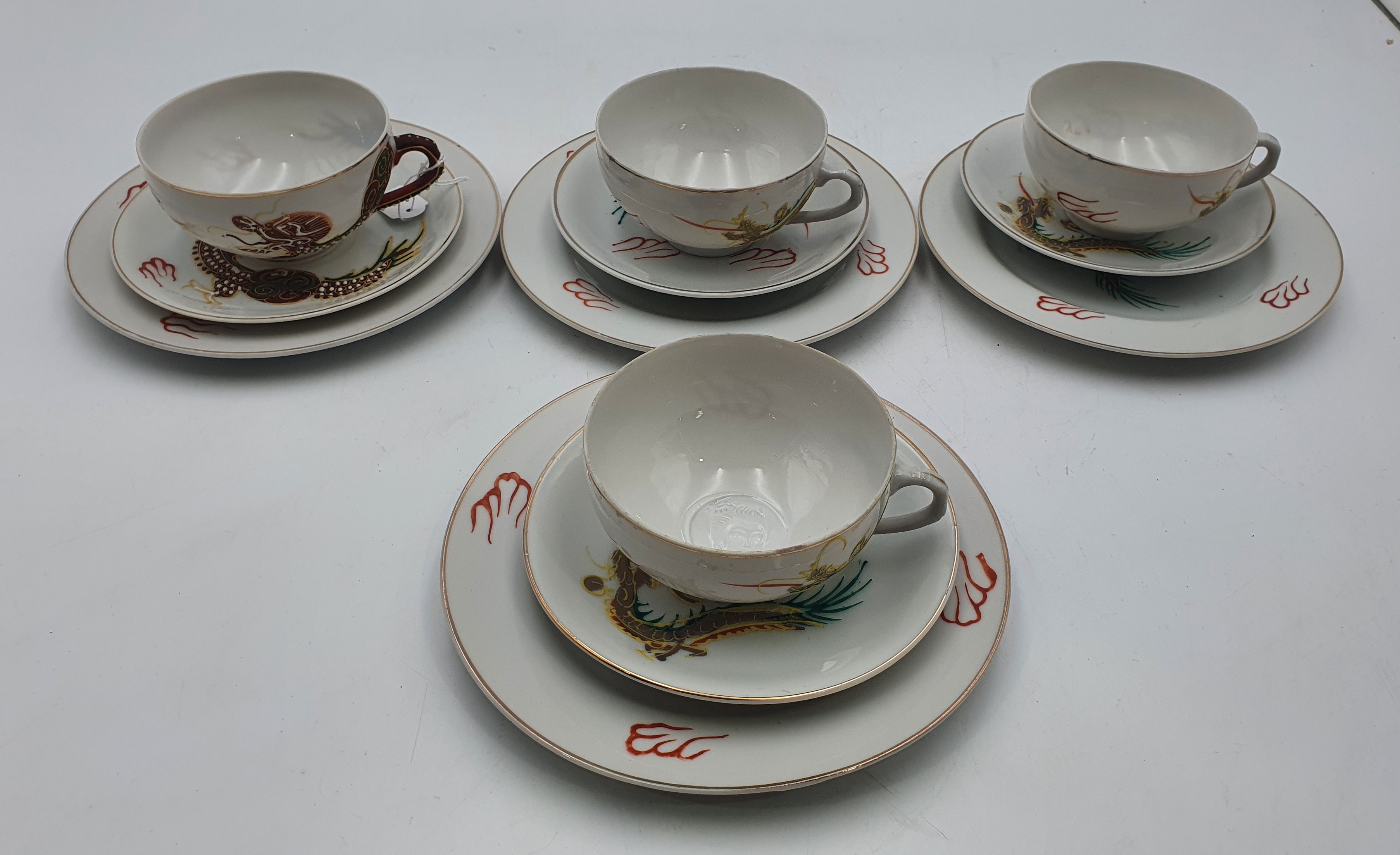 673 · THREE VINTAGE JAPANESE LITHOPHANE TEACUPS AND SAUCERS