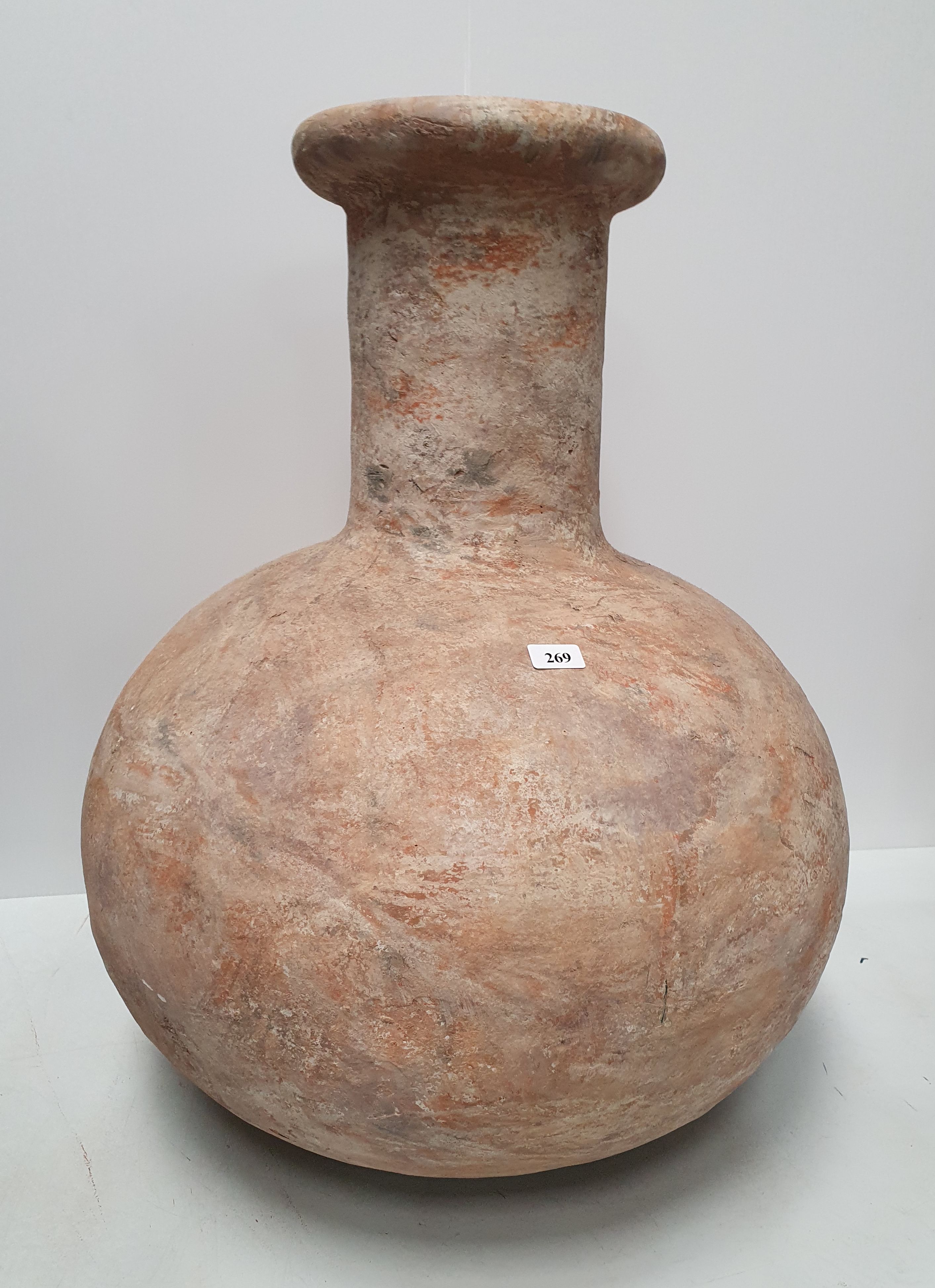 269 · A LARGE BULBOUS CLAY FLOOR VASE