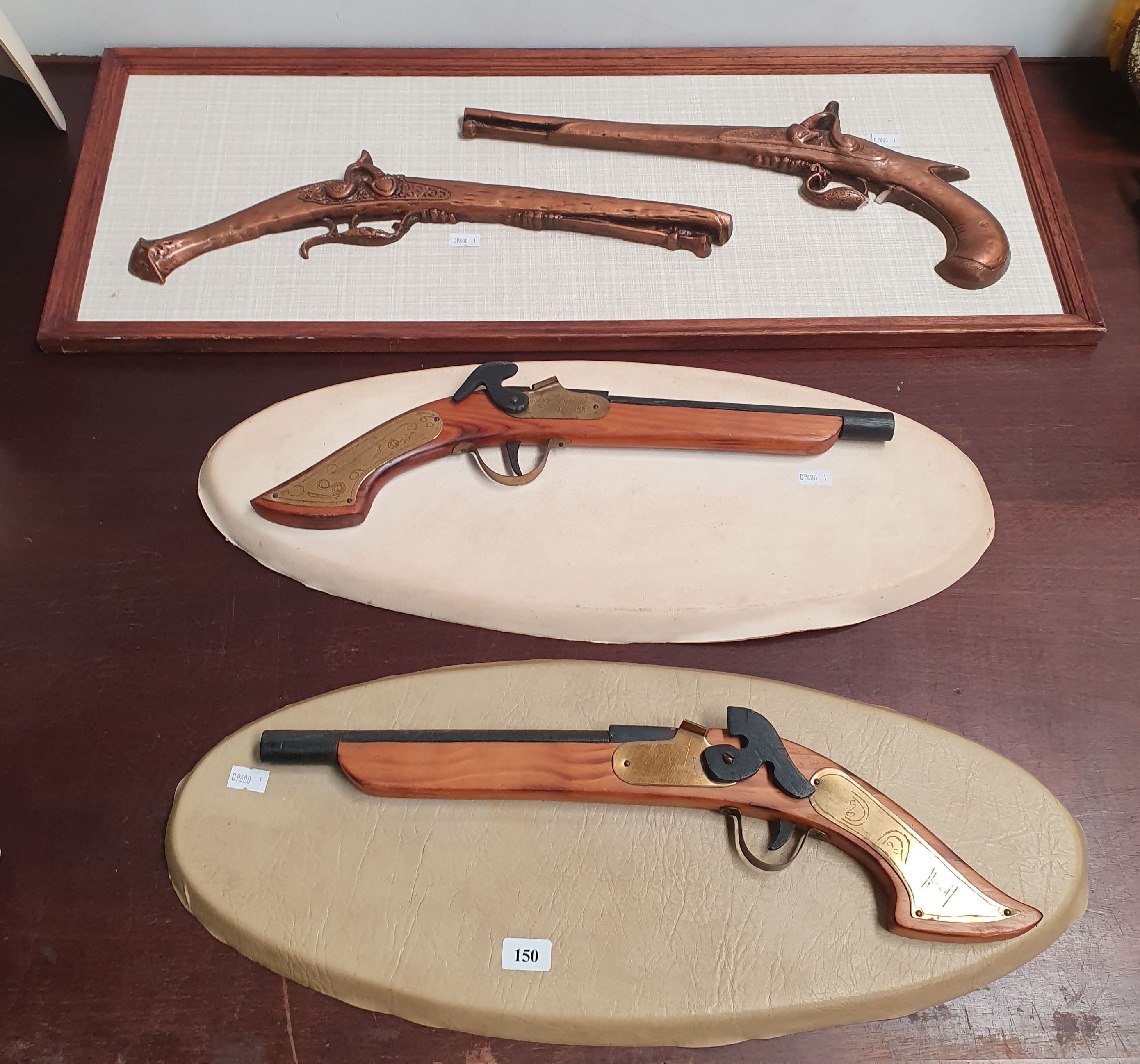 Two Mounted Replica Guns