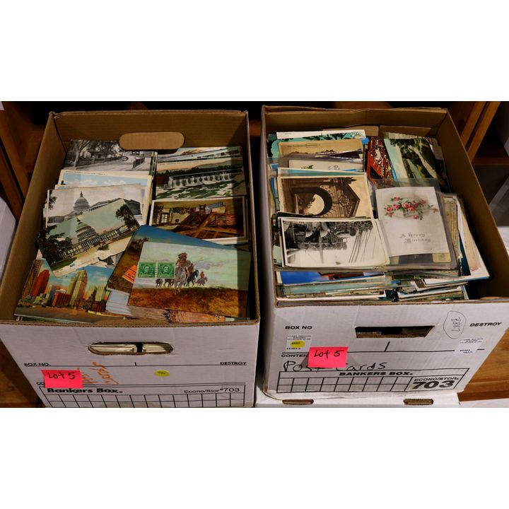 Two boxes of predominantly United States postcards