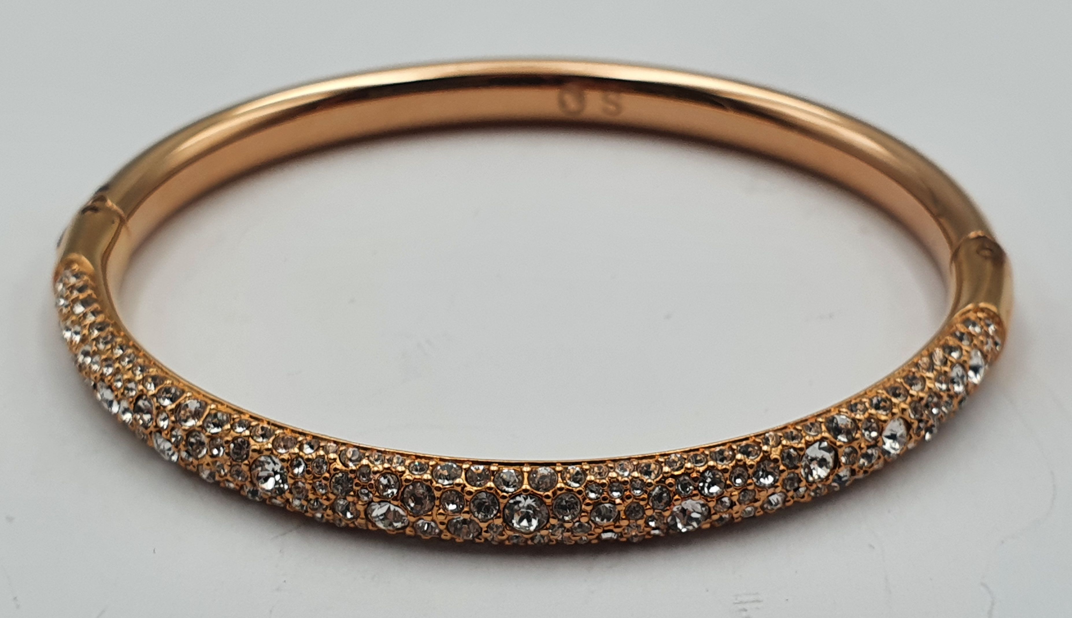 292 · A SWAROVSKI CRYSTAL GEM SET CUFF BANGLE