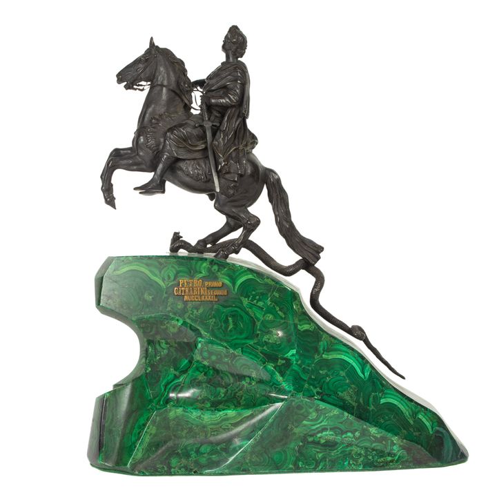 A Continental patinated bronze and malachite equestrian group
