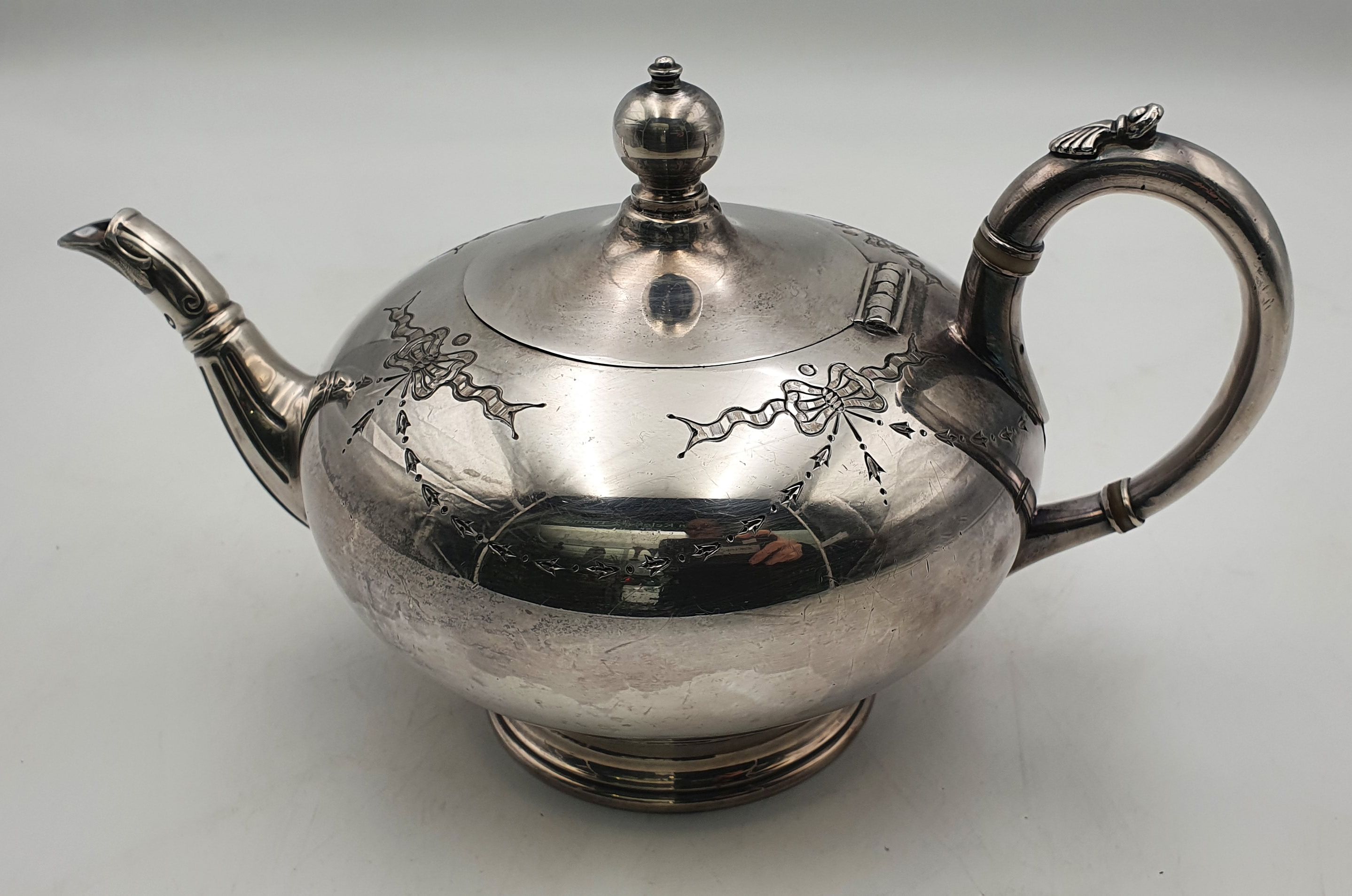 147 · A SILVER PLATED TEA POT