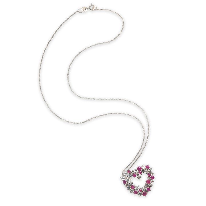 A ruby, white sapphire and silver pendant necklace