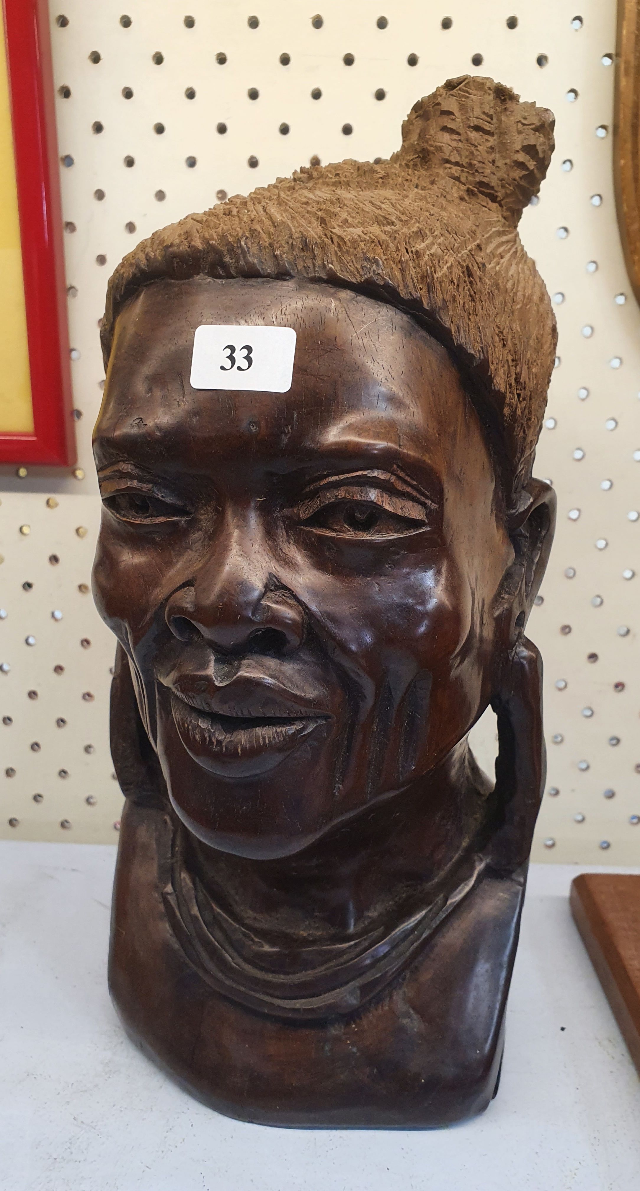 33 · A CARVED WOODEN SHONA BUST