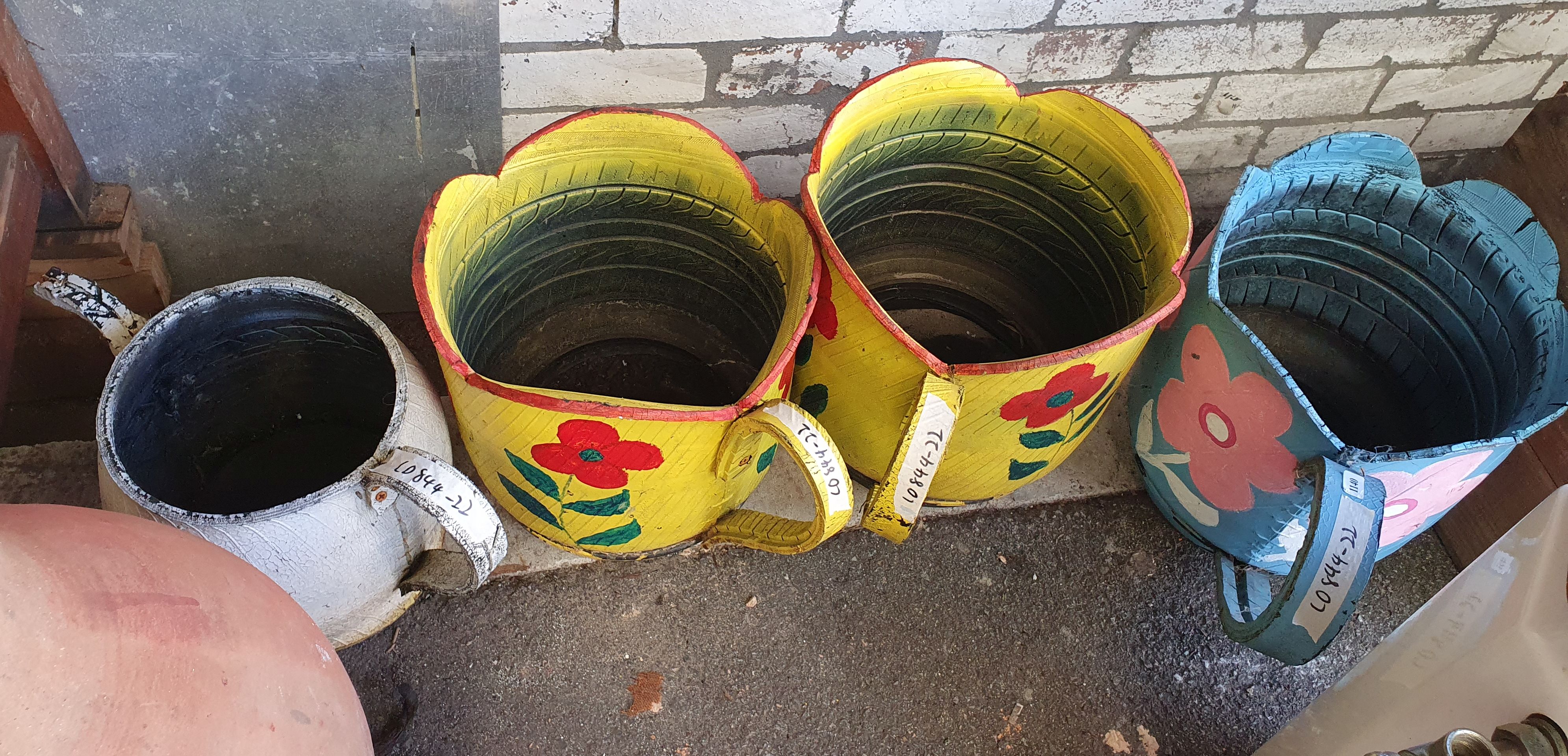 1140 · A GROUP OF TIRE DECORATIONS