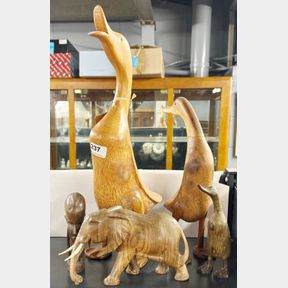 Two carved wooden ducks, two wooden items and one resin, tallest 46cm.