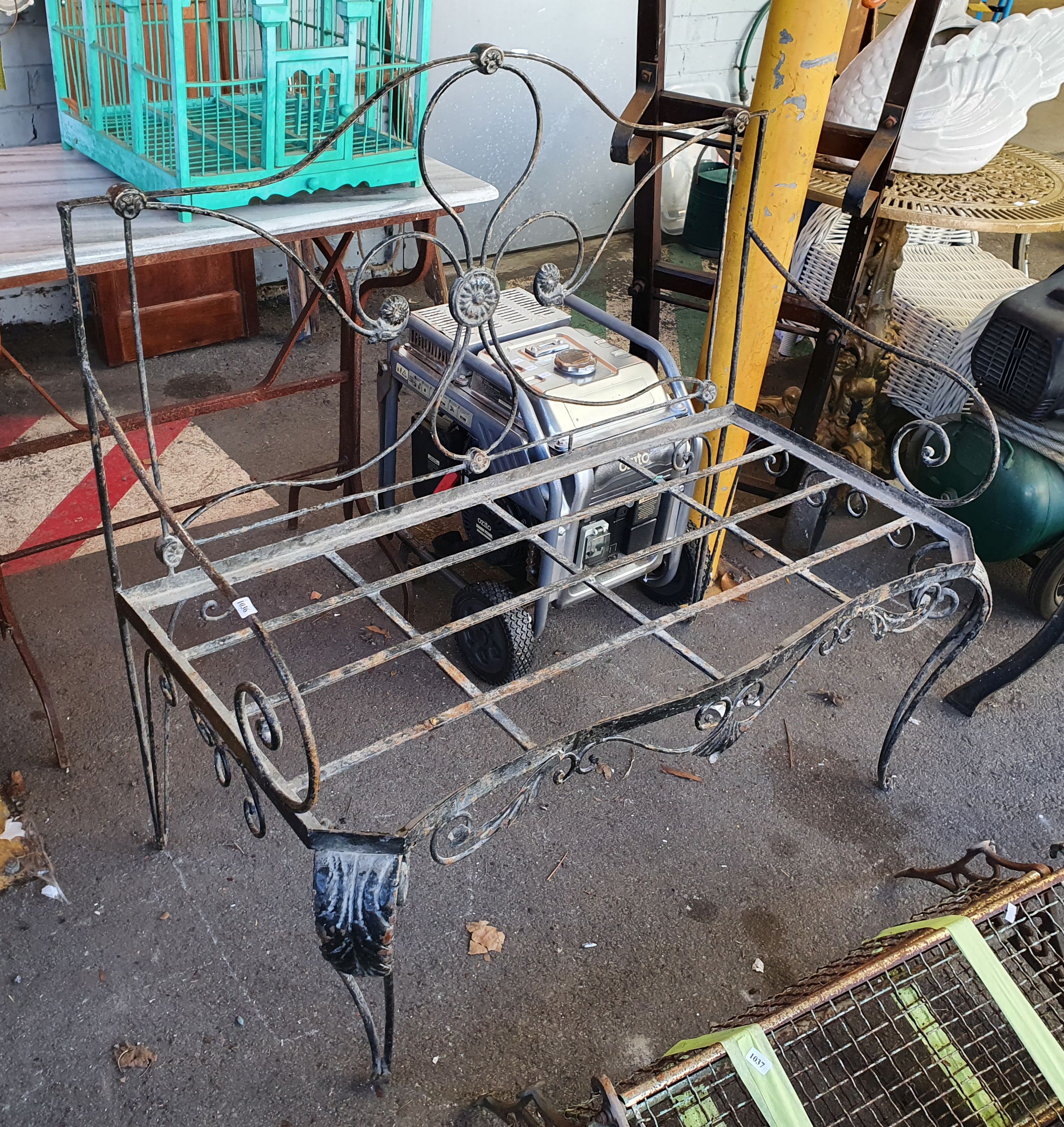 1036 · A WROUGHT IRON SETTEE