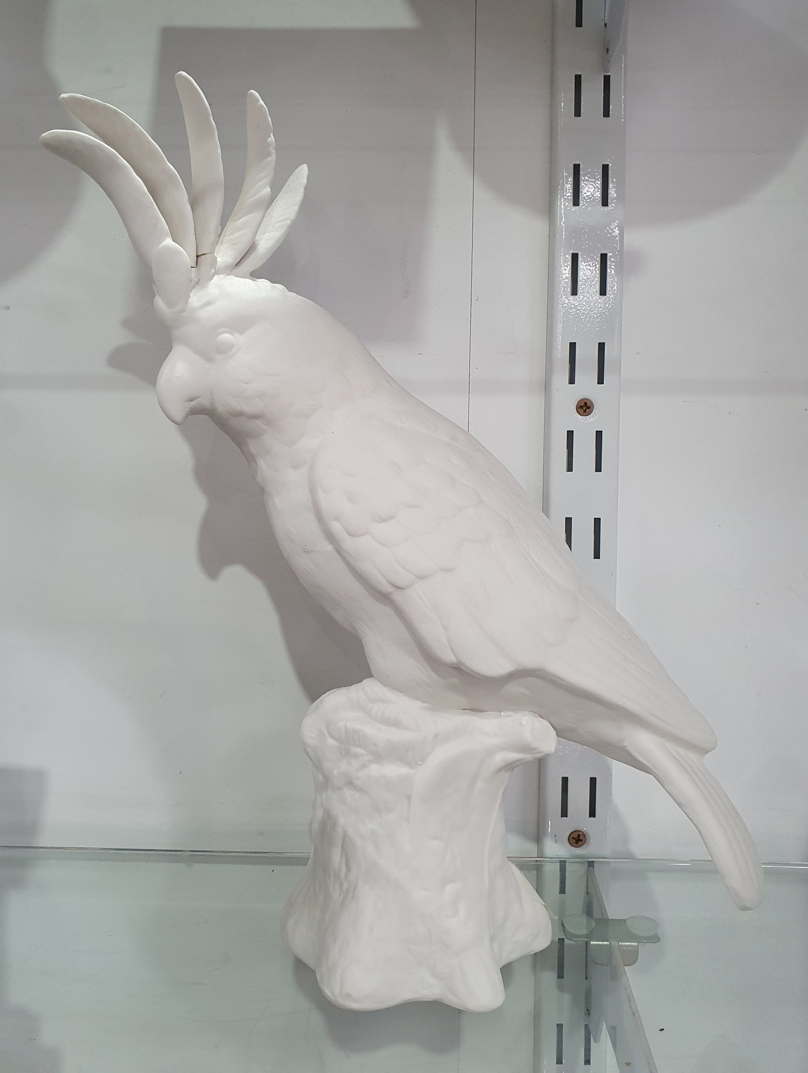 A Bisque Porcelain Figure Of A Cockatoo