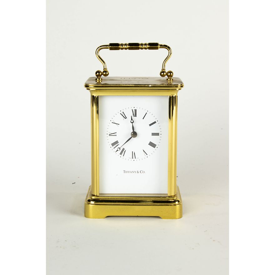 A Tiffany & Co lacquered brass carriage clock with Swiss battery movement