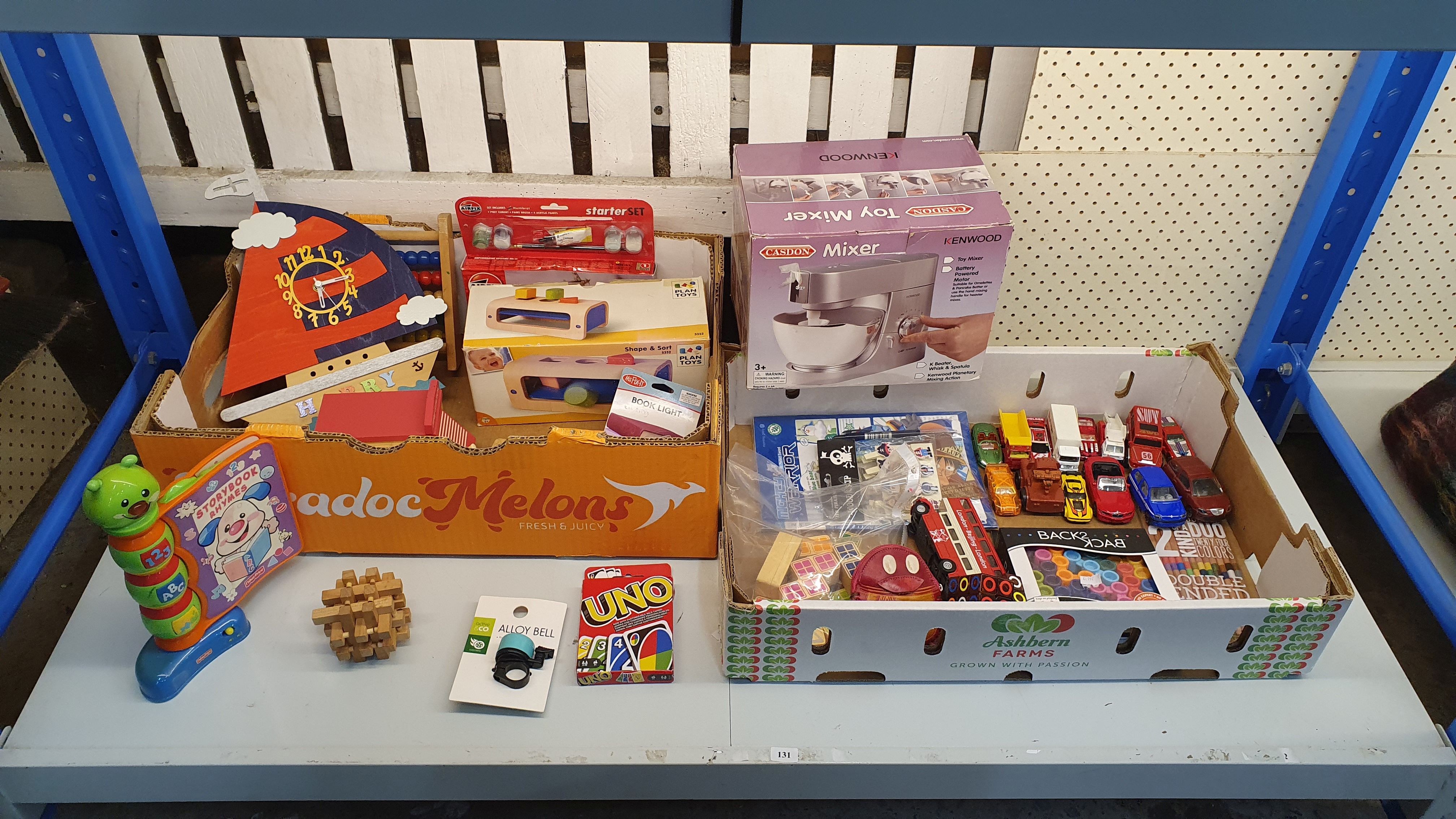 131 · TWO BOXES OF CURATED TOYS AND GAMES
