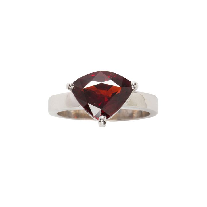 A garnet and 18k white gold ring