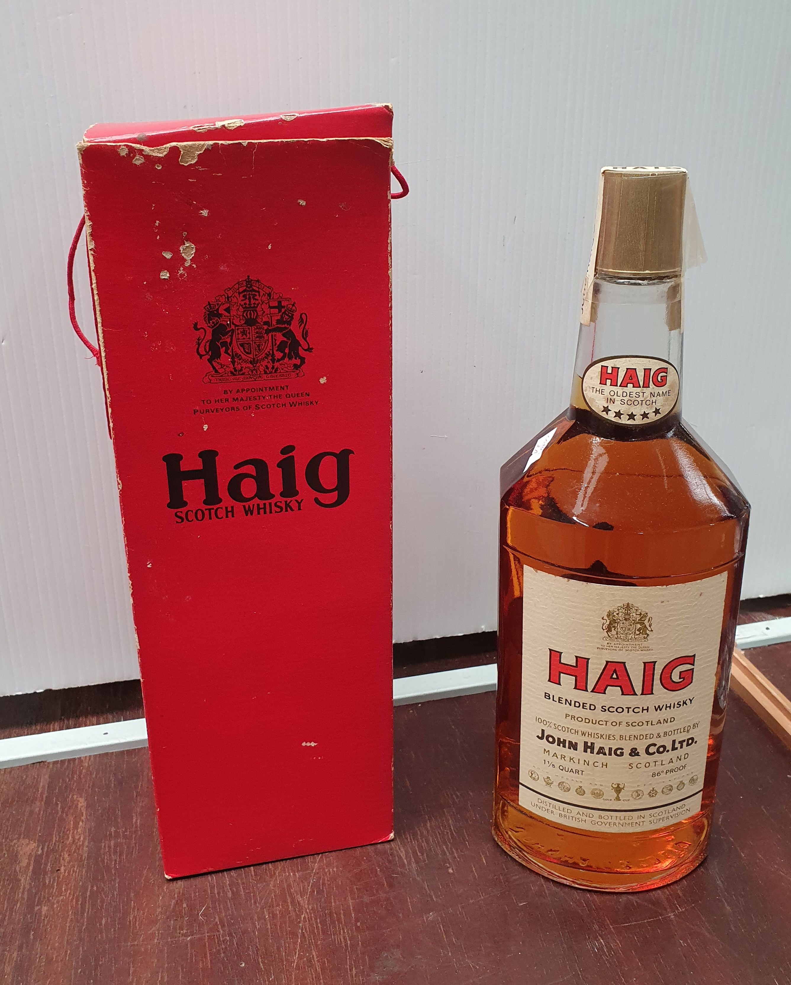 A BOTTLE OF HAIG SCOTCH WHISKY