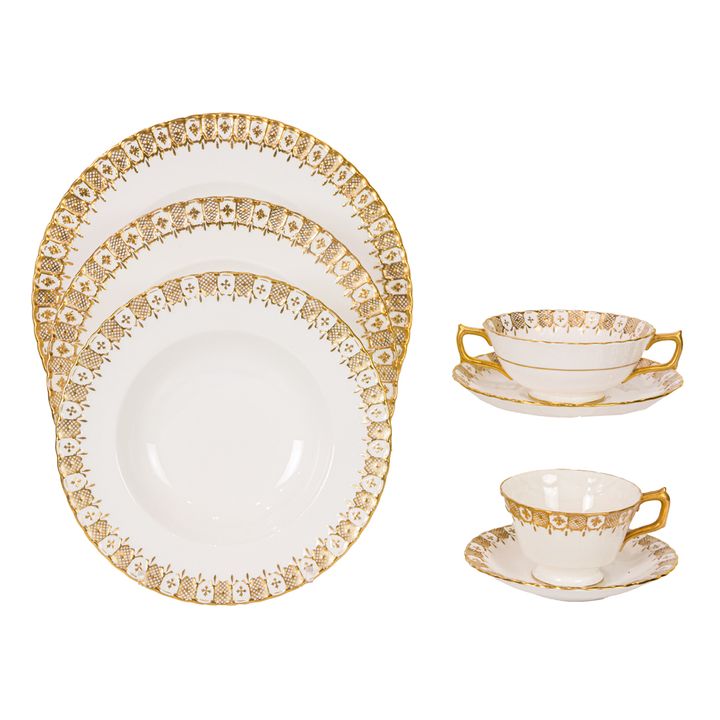 A Royal Crown Derby porcelain assembled dinner service in the Heraldic Gold pattern