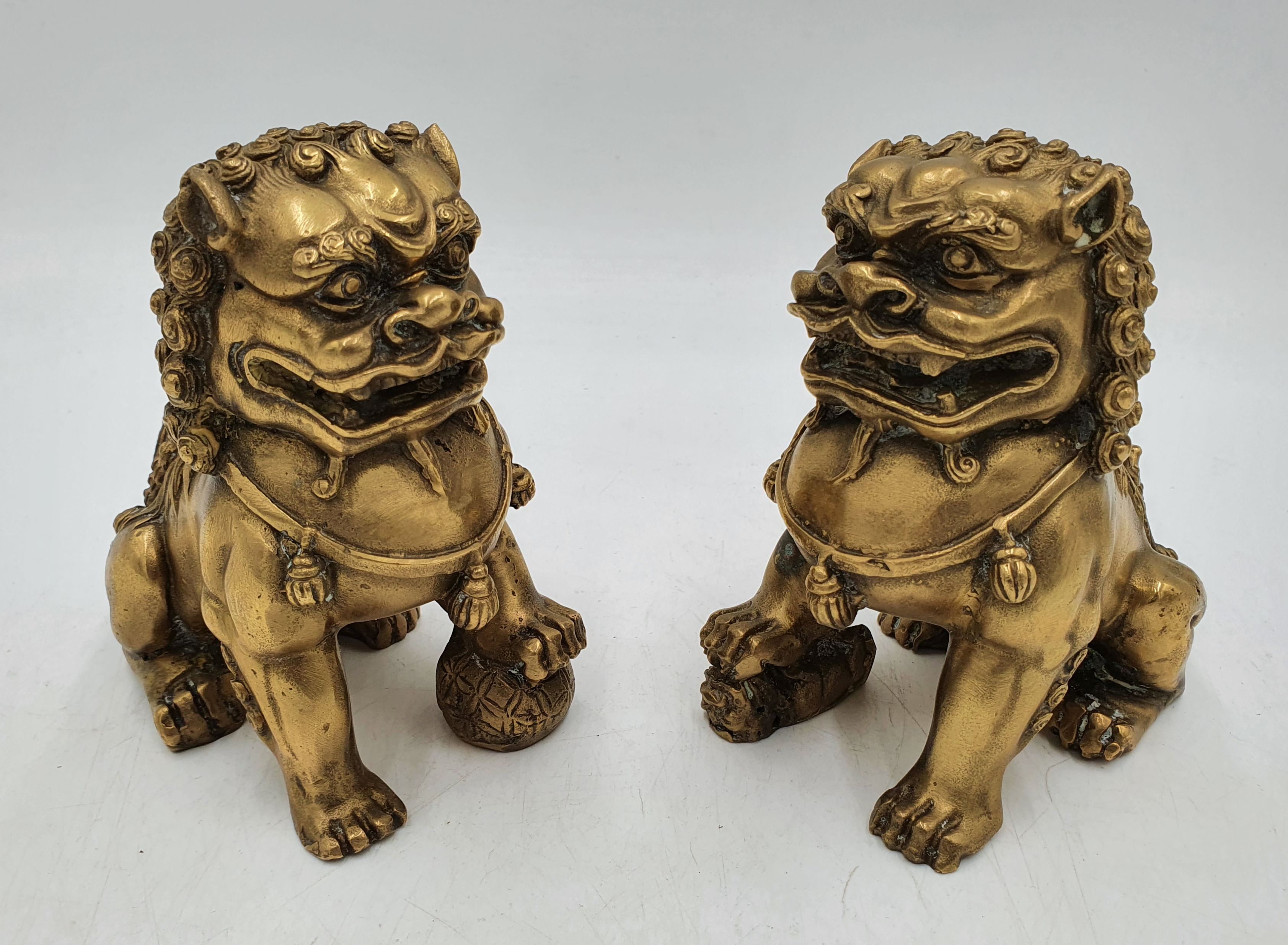 569 · A PAIR CHINESE BRASS FOO DOGS
