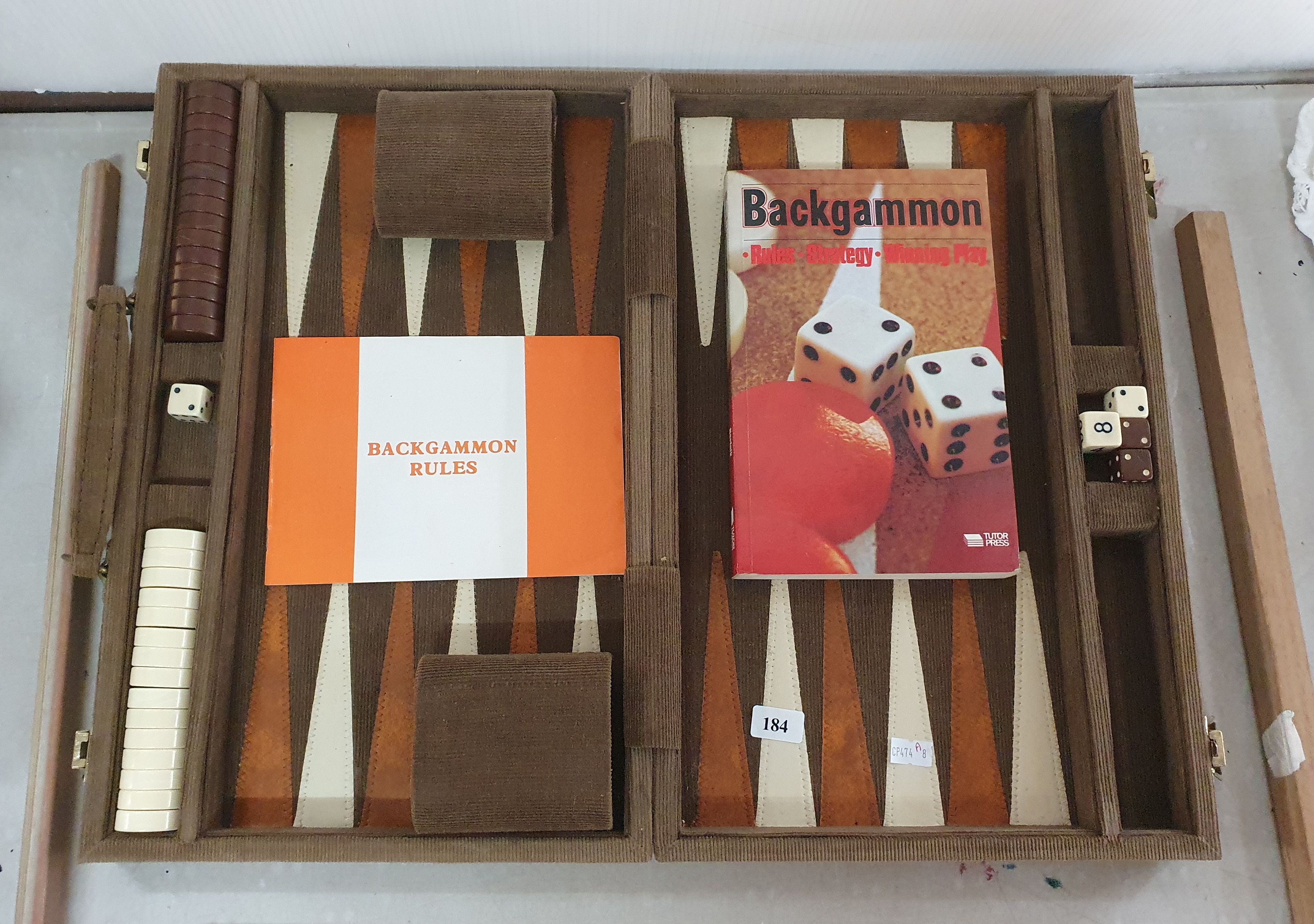 A Cased Backgammon Set With Additional Reference Book