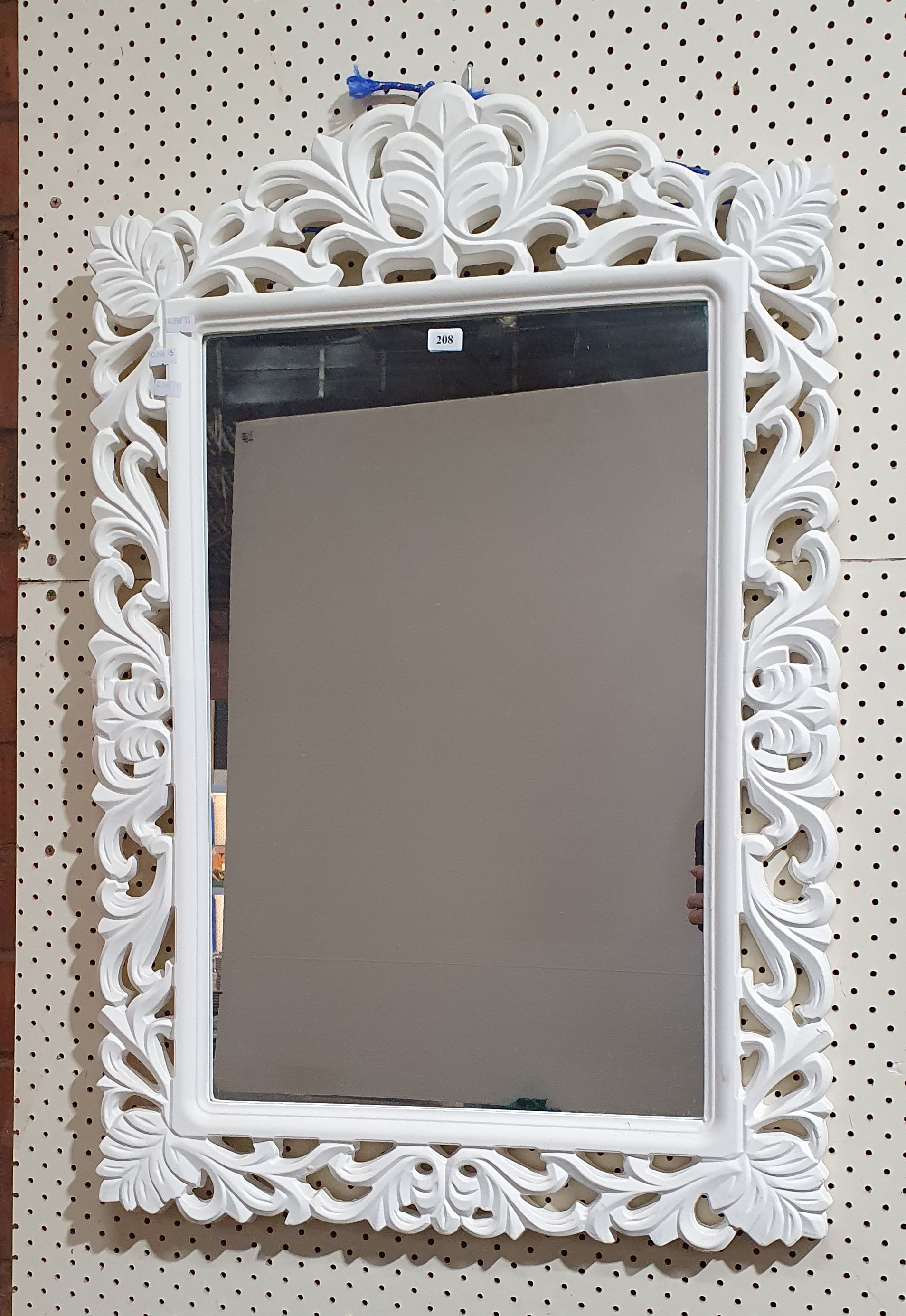 208 · A WALL MIRROR WITH DECORATIVE WHITE FRAME