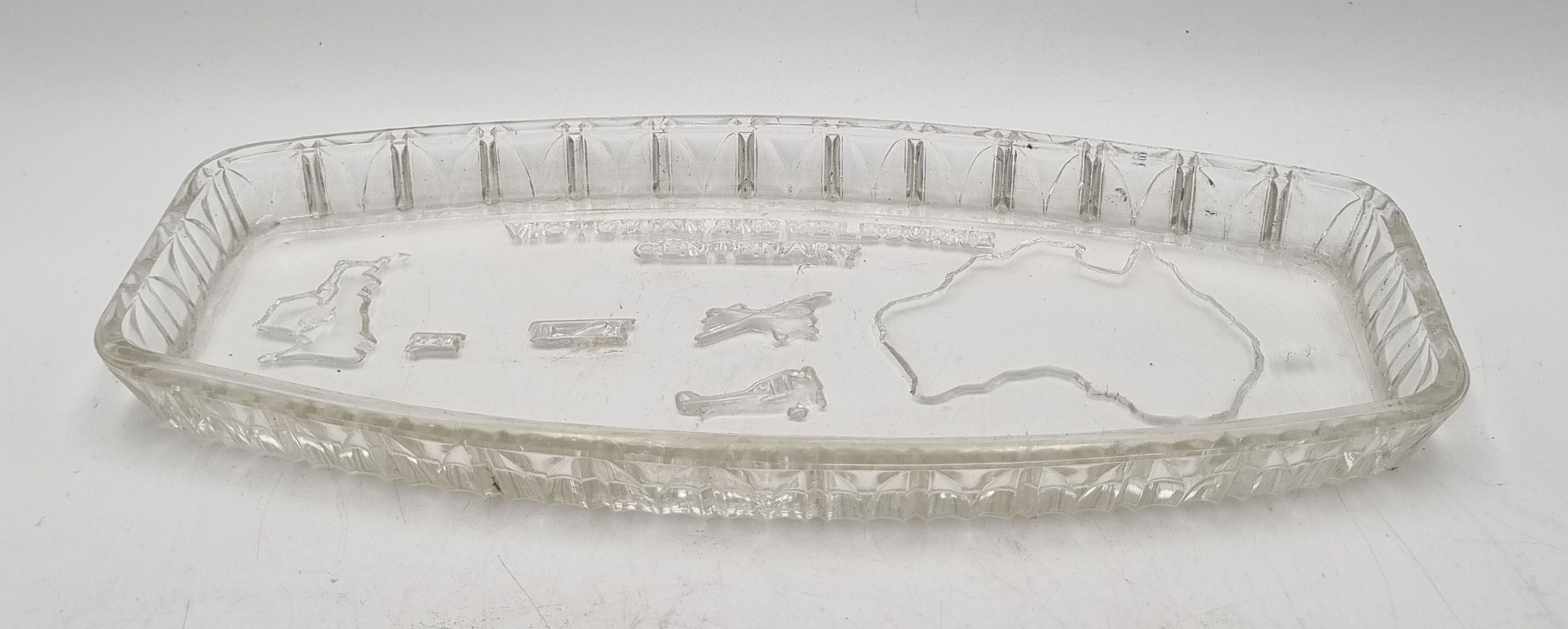 607 · AN ART DECO PRESSED GLASS LONDON TO MELBOURNE AIR RACE SOUVENIR SANDWICH TRAY