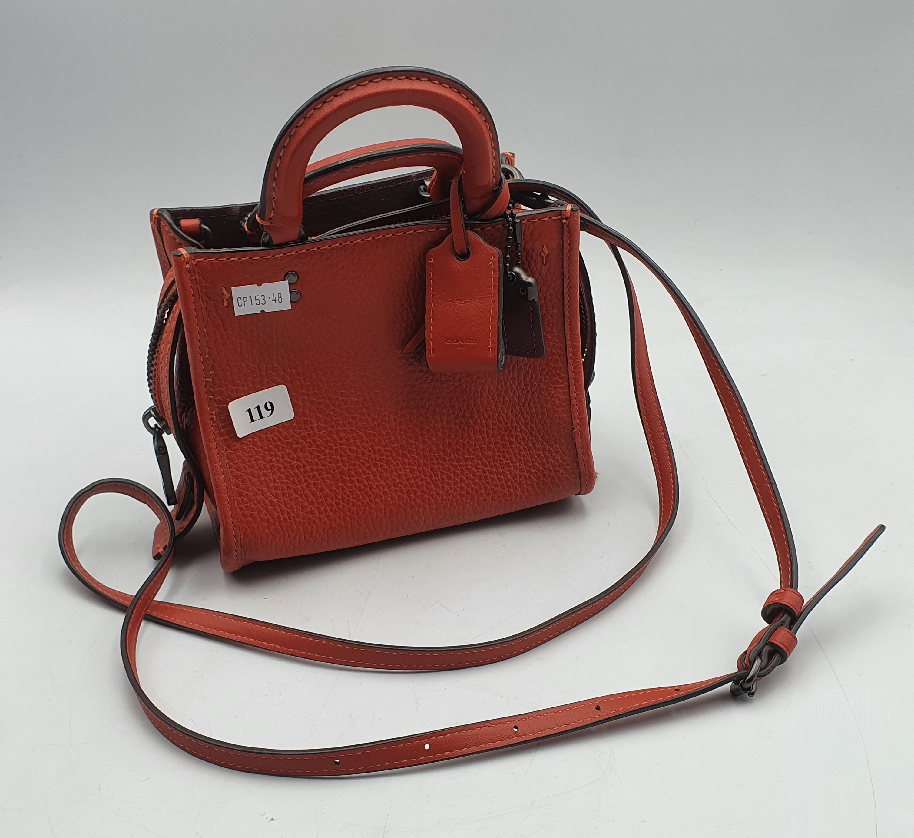 119 · A VERY SMALL COACH HANDBAG