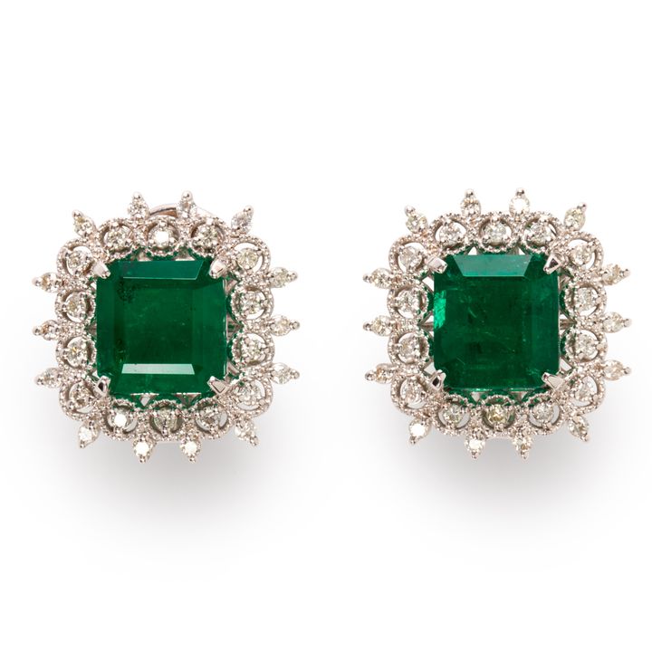 A pair of emerald, diamond and eighteen karat white gold earrings