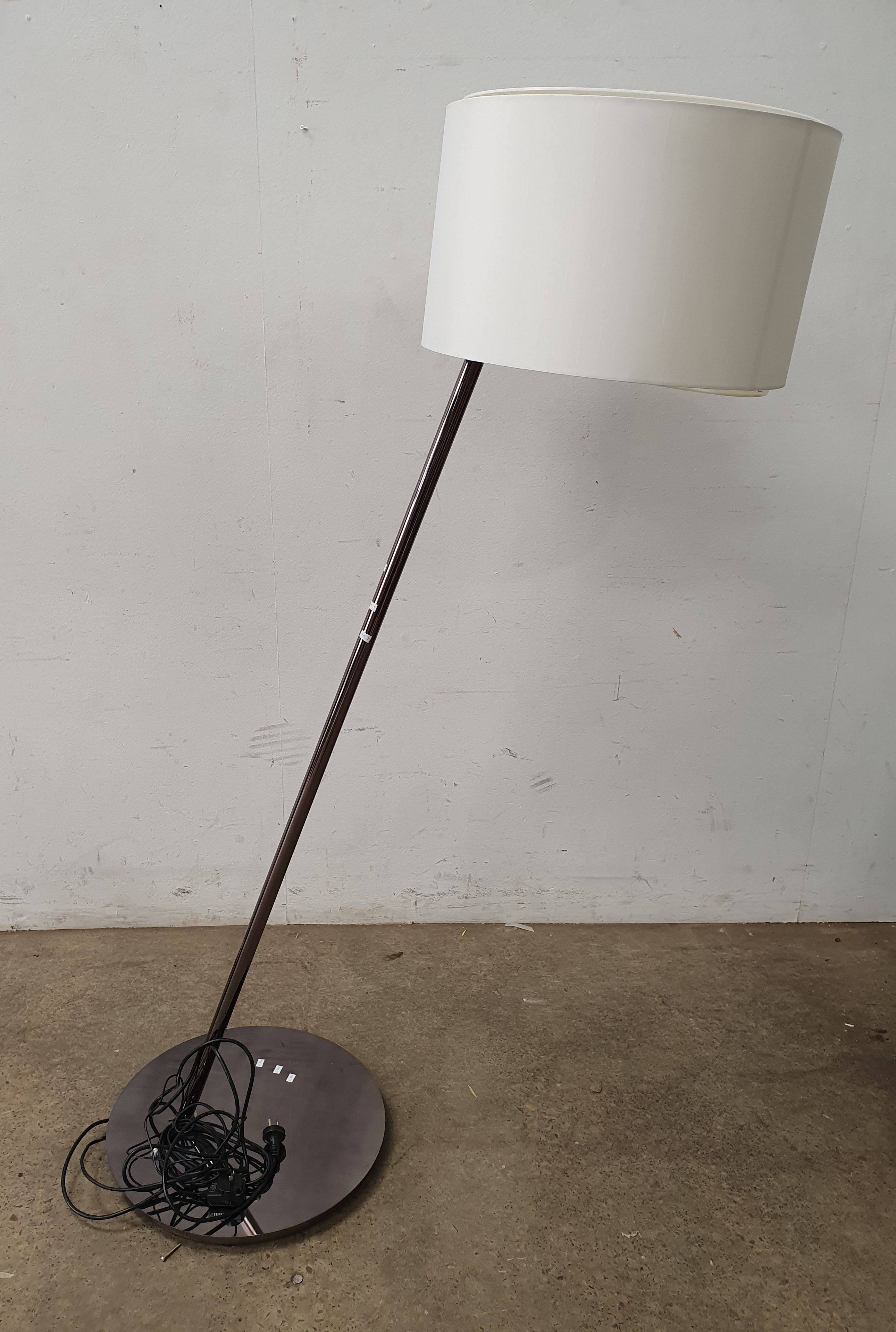 A Leaning Chrome Designer Style Floor Lamp