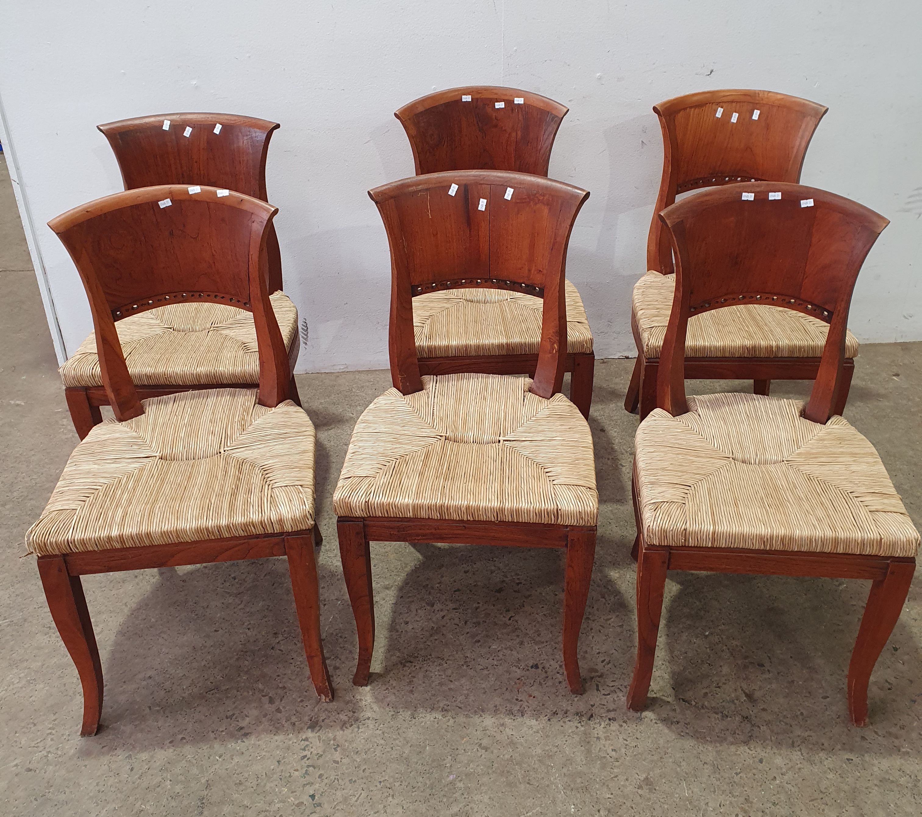 A Set Of Six Teak Chairs