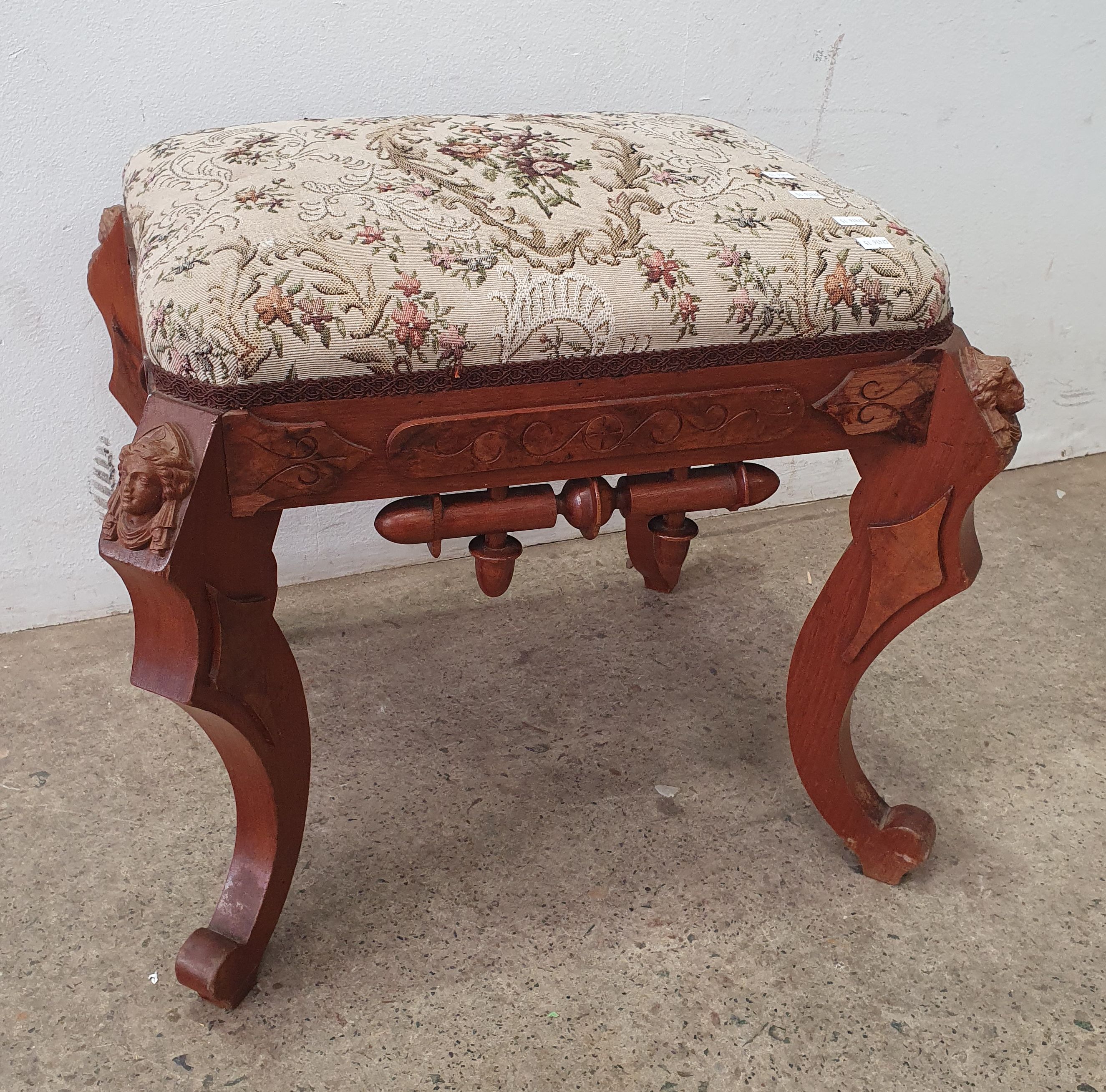 2053 · A CARVED WOODEN FOOTSTOOL