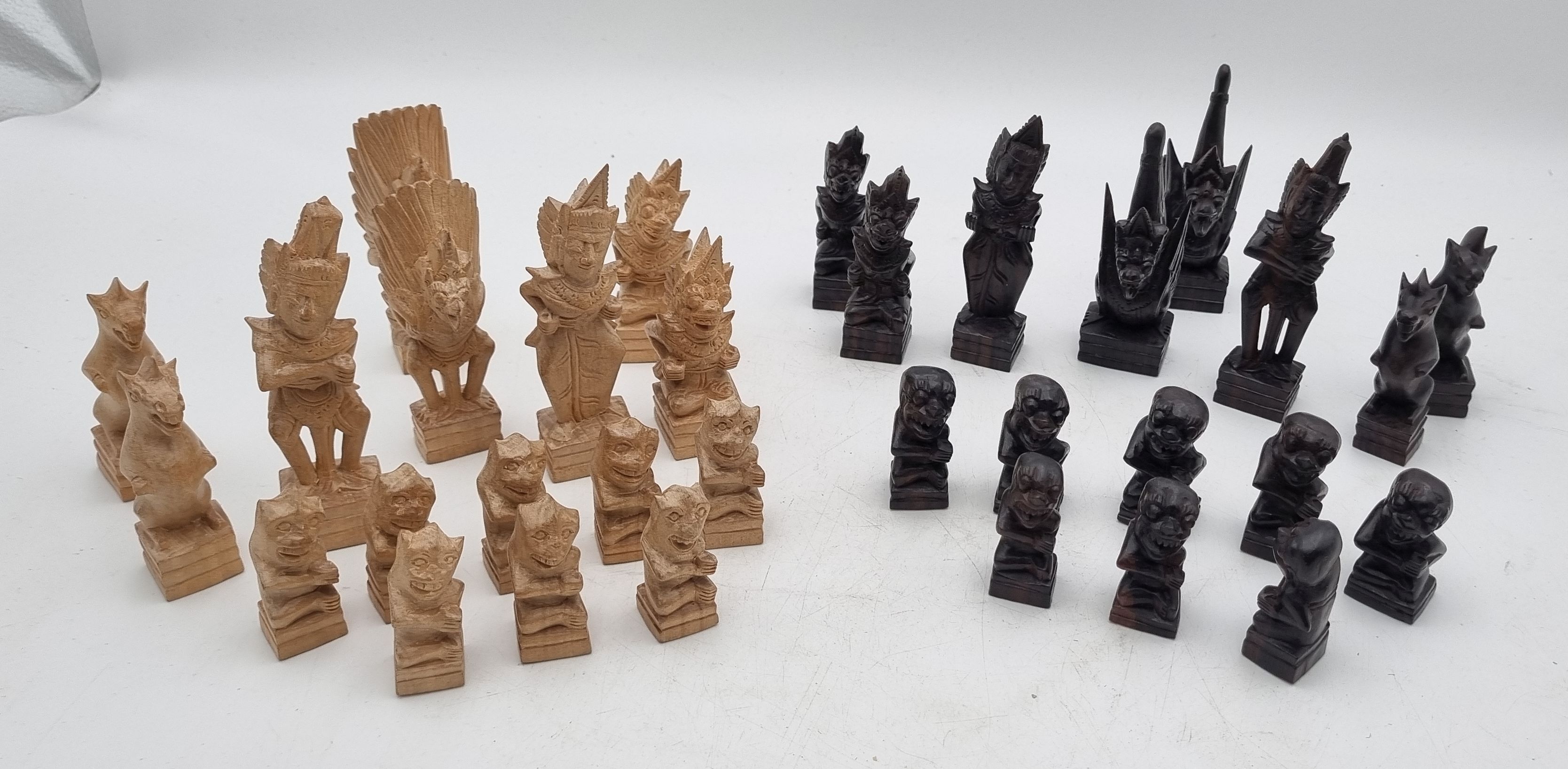355 · A SET OF BALINESE WOODEN CHESS PIECES