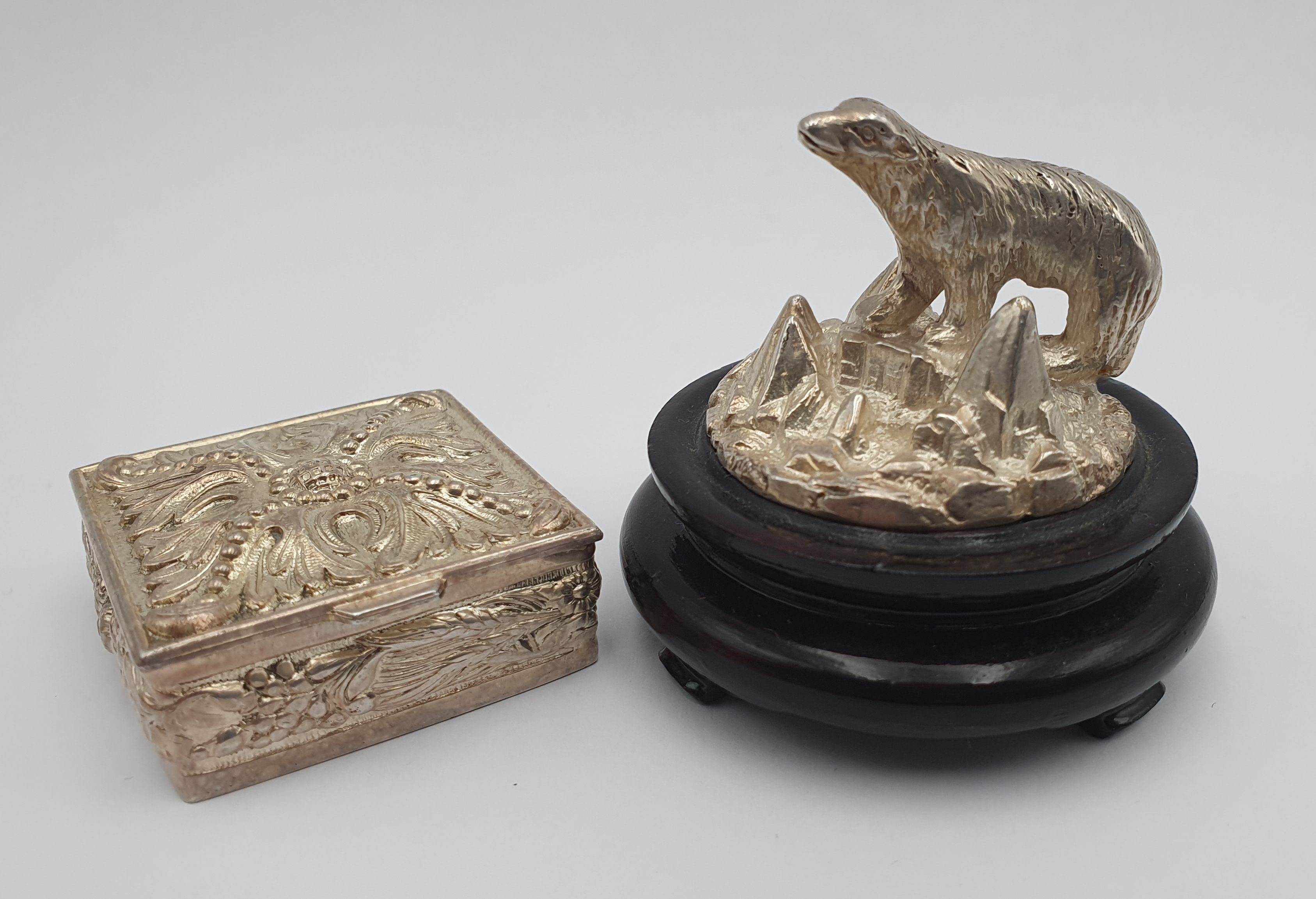 344 · A SILVERPLATED PILL BOX AND POLAR BEAR FIGURE ON STAND