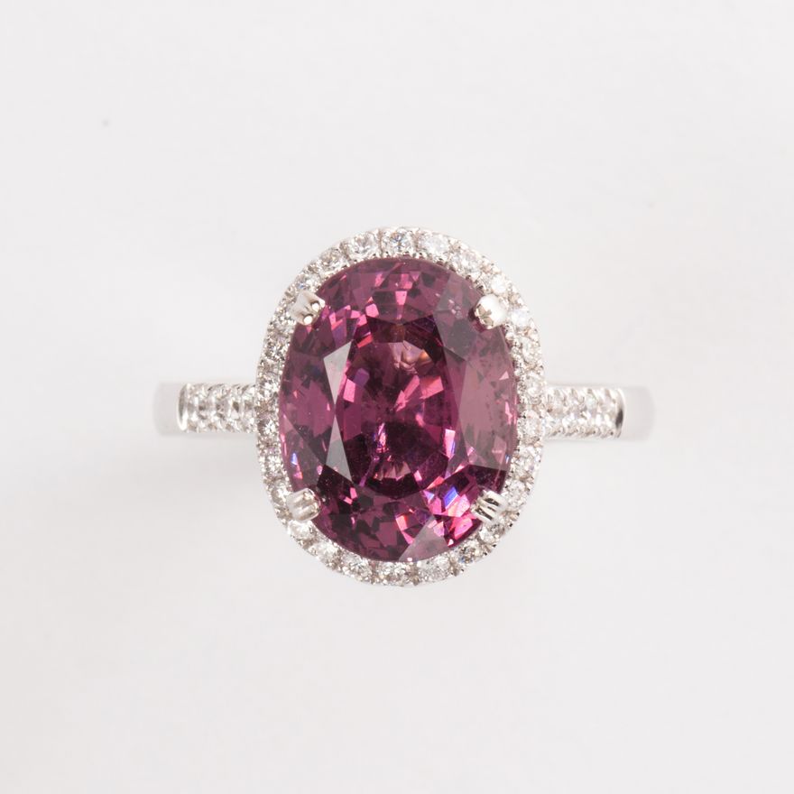 A pink spinel diamond and eighteen karat white gold ring