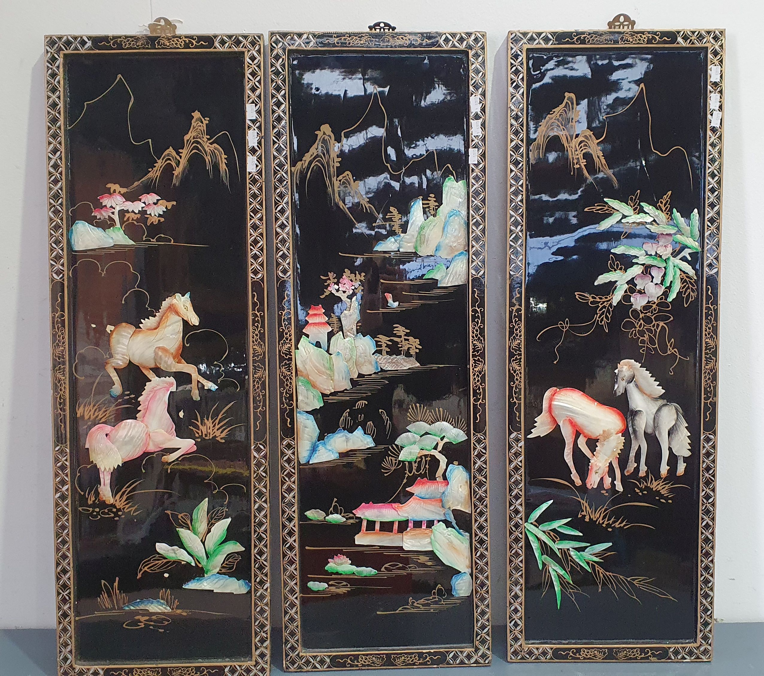 A SET OF THREE ORIENTAL PANELS